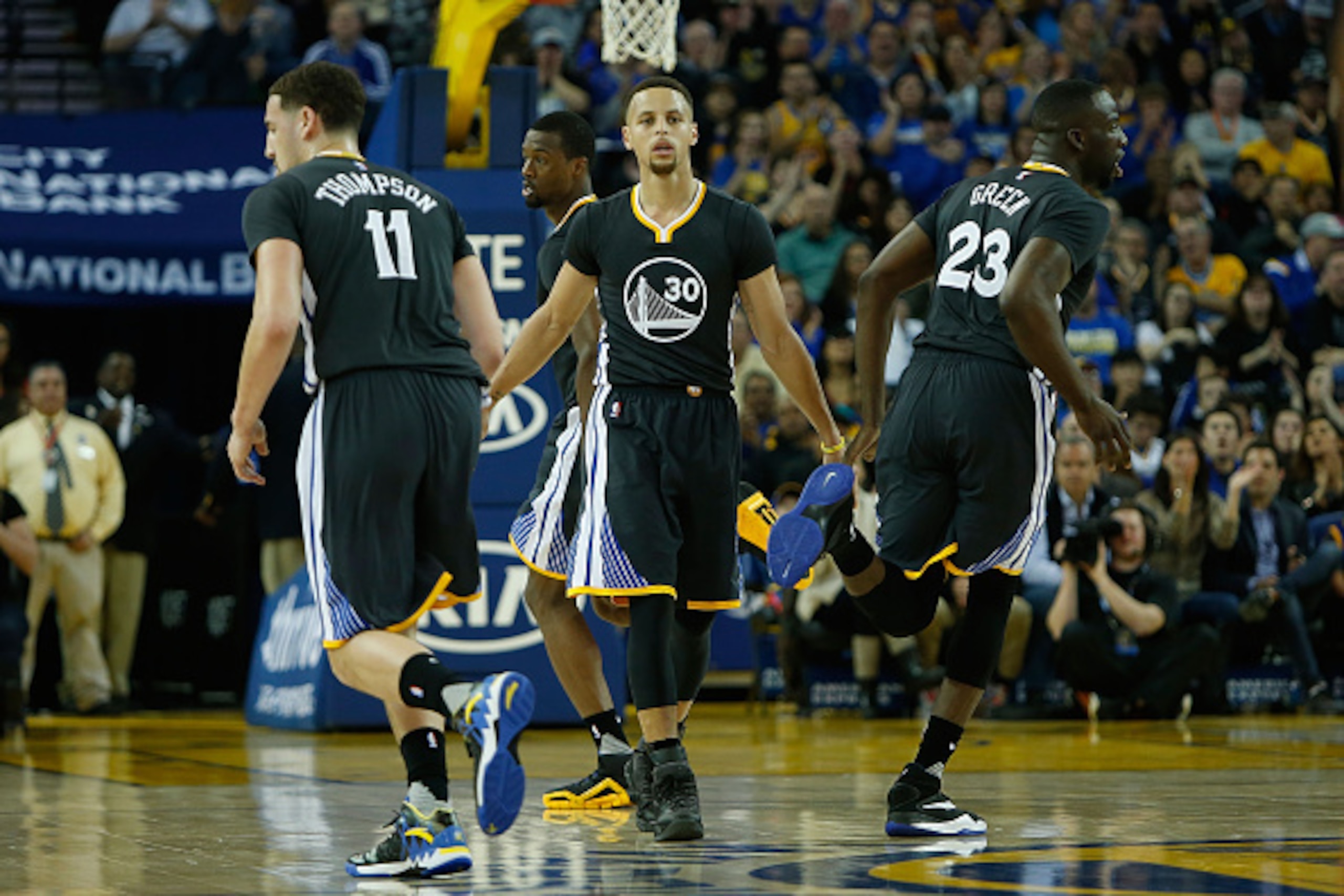 OAKLAND, CA - MARCH 12: Klay Thompson #11, Stephen Curry #30 and Draymond Green #23 of the Golden State Warriors celebrate a basket against the Phoenix Suns at ORACLE Arena on March 12, 2016 in Oakland, California. NOTE TO USER: User expressly acknowledge OAKLAND, CA - MARCH 12: Klay Thompson #11, Stephen Curry #30 and Draymond Green #23 of the Golden State Warriors celebrate a basket against the Phoenix Suns at ORACLE Arena on March 12, 2016 in Oakland, California. NOTE TO USER: User expressly acknowledge