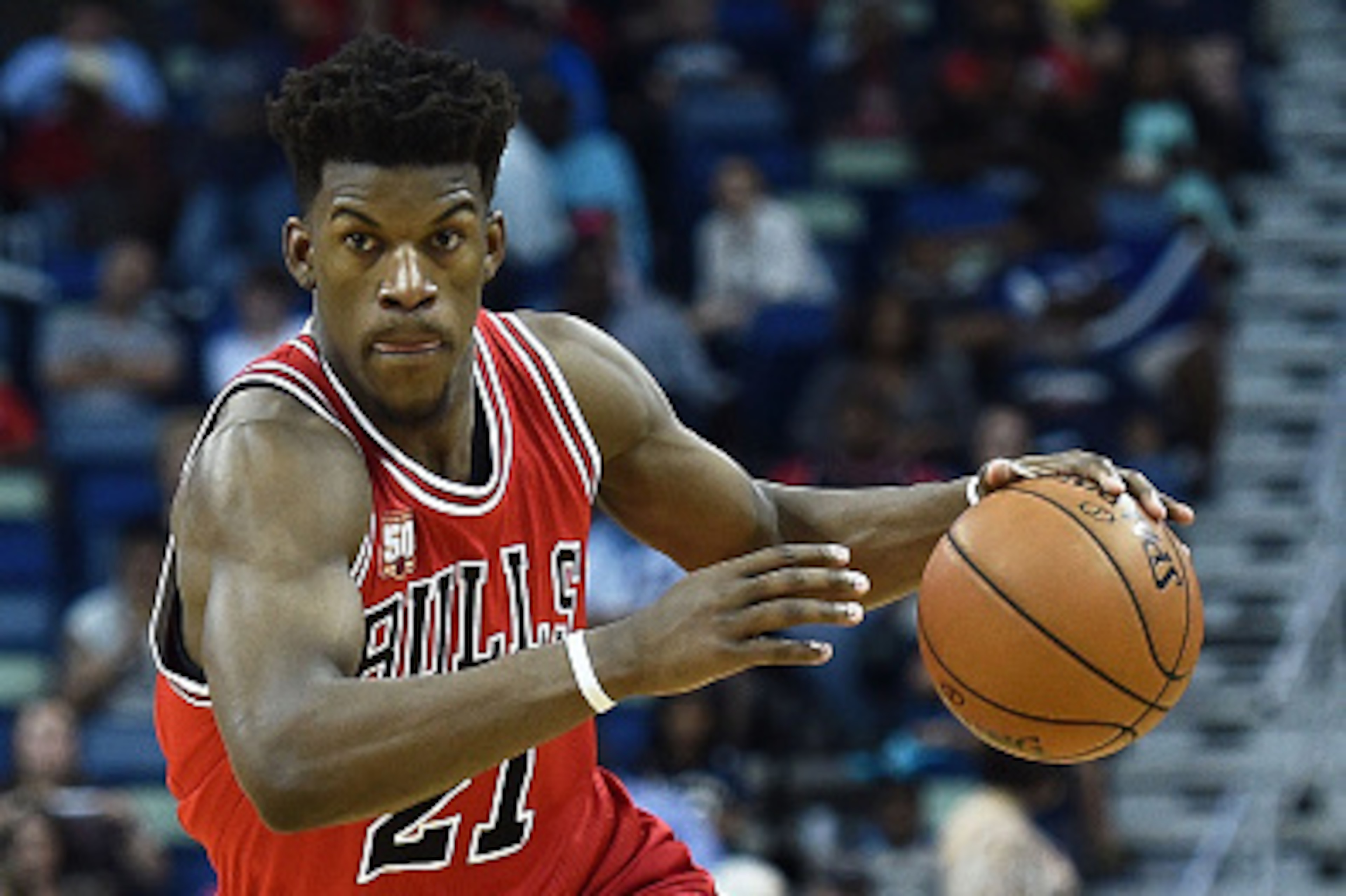 NEW ORLEANS, LA - APRIL 11:  Jimmy Butler #21 of the Chicago Bulls handles the ball during a game against the New Orleans Pelicans at the Smoothie King Center on April 11, 2016 in New Orleans, Louisiana. NOTE TO USER: User expressly acknowledges and agree