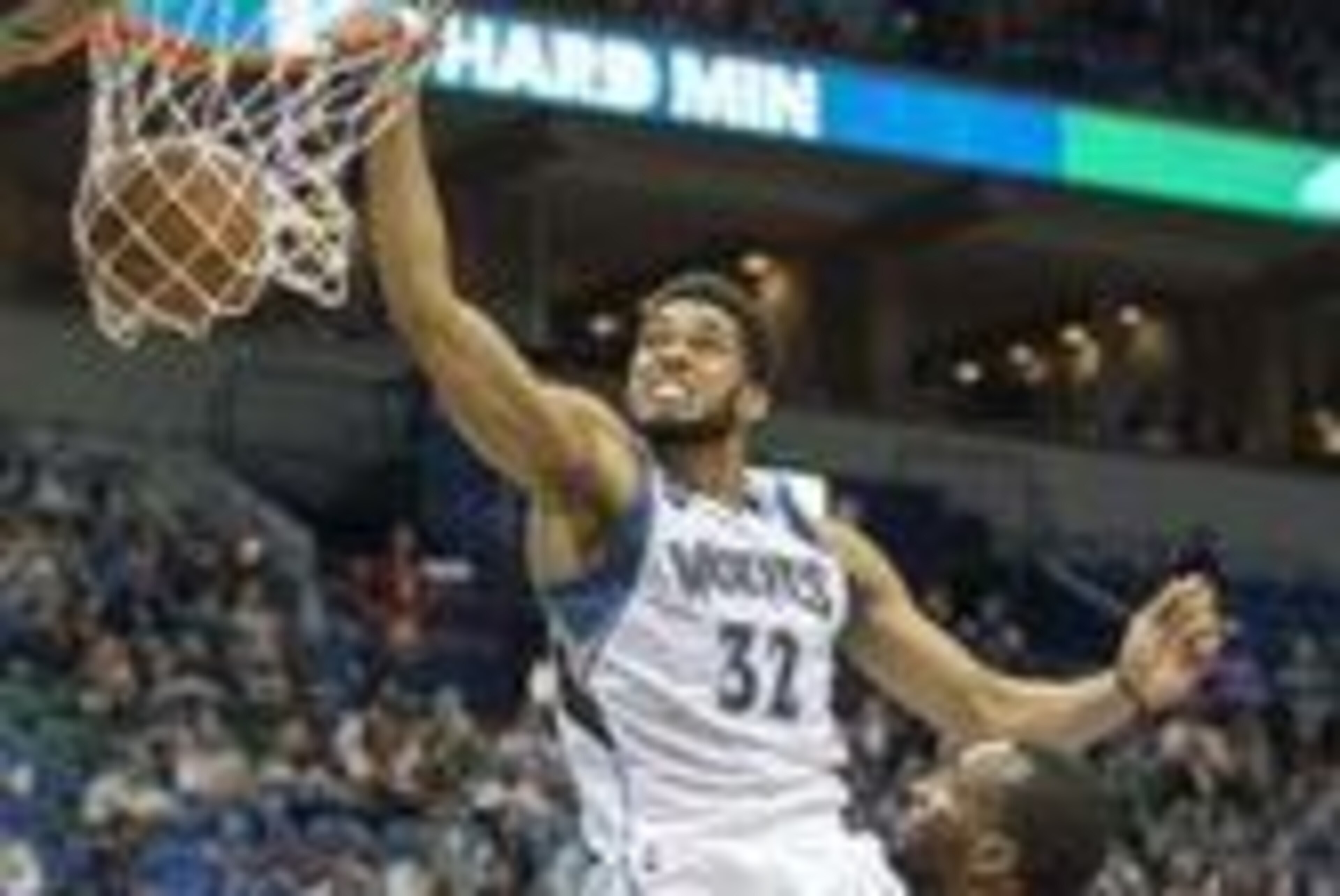 Apr 13, 2016; Minneapolis, MN, USA; Minnesota Timberwolves center Karl-Anthony Towns (32) dunks the ball in the second half against the New Orleans Pelicans at Target Center. The Timberwolves won 144-109. Mandatory Credit: Jesse Johnson-USA TODAY Sports