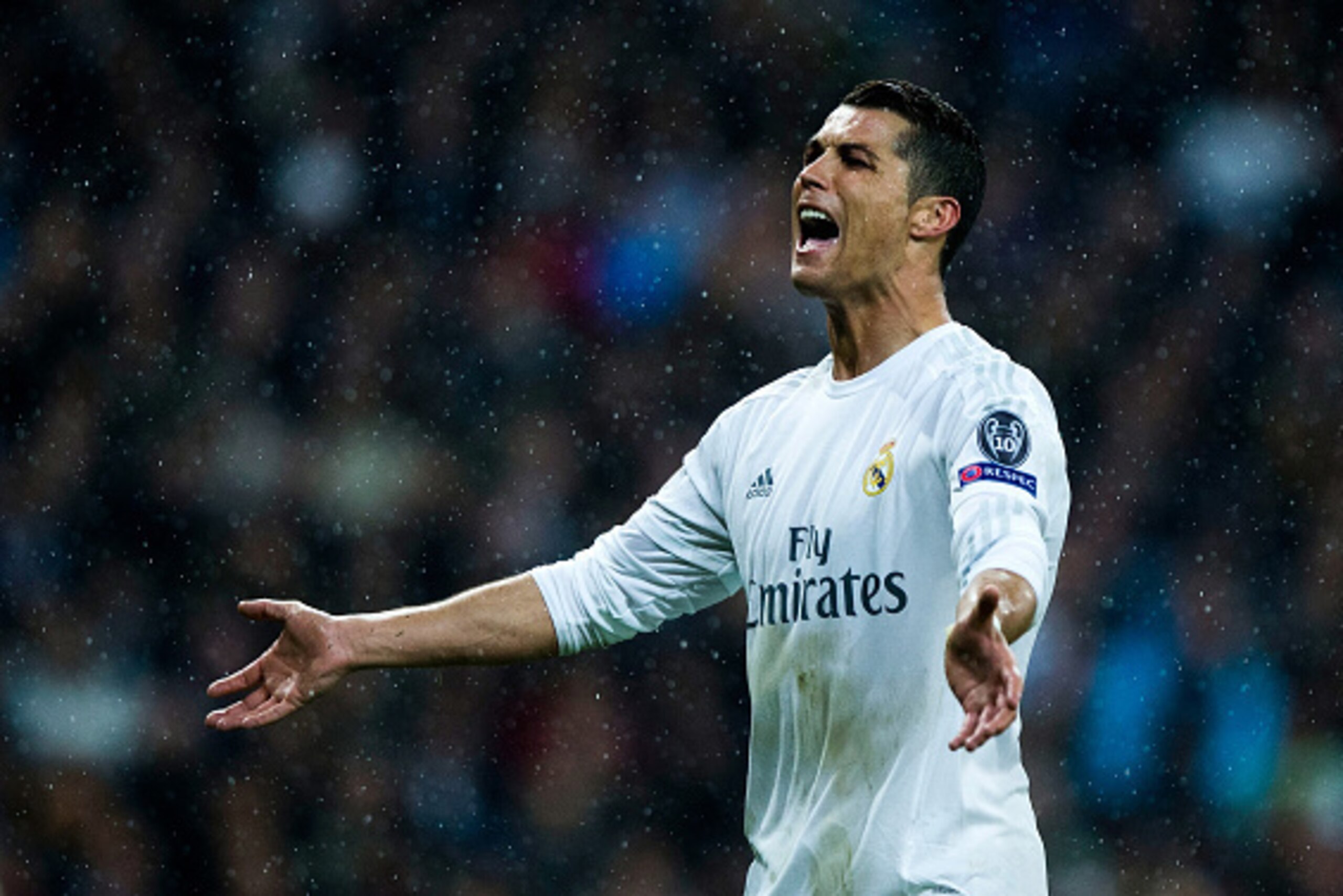 MADRID, SPAIN - APRIL 12:  Cristiano Ronaldo of Real Madrid celebrates victory and reaching the semi finals with the crowd after the UEFA Champions League quarter final second leg match between Real Madrid CF and VfL Wolfsburg at Estadio Santiago Bernabeu