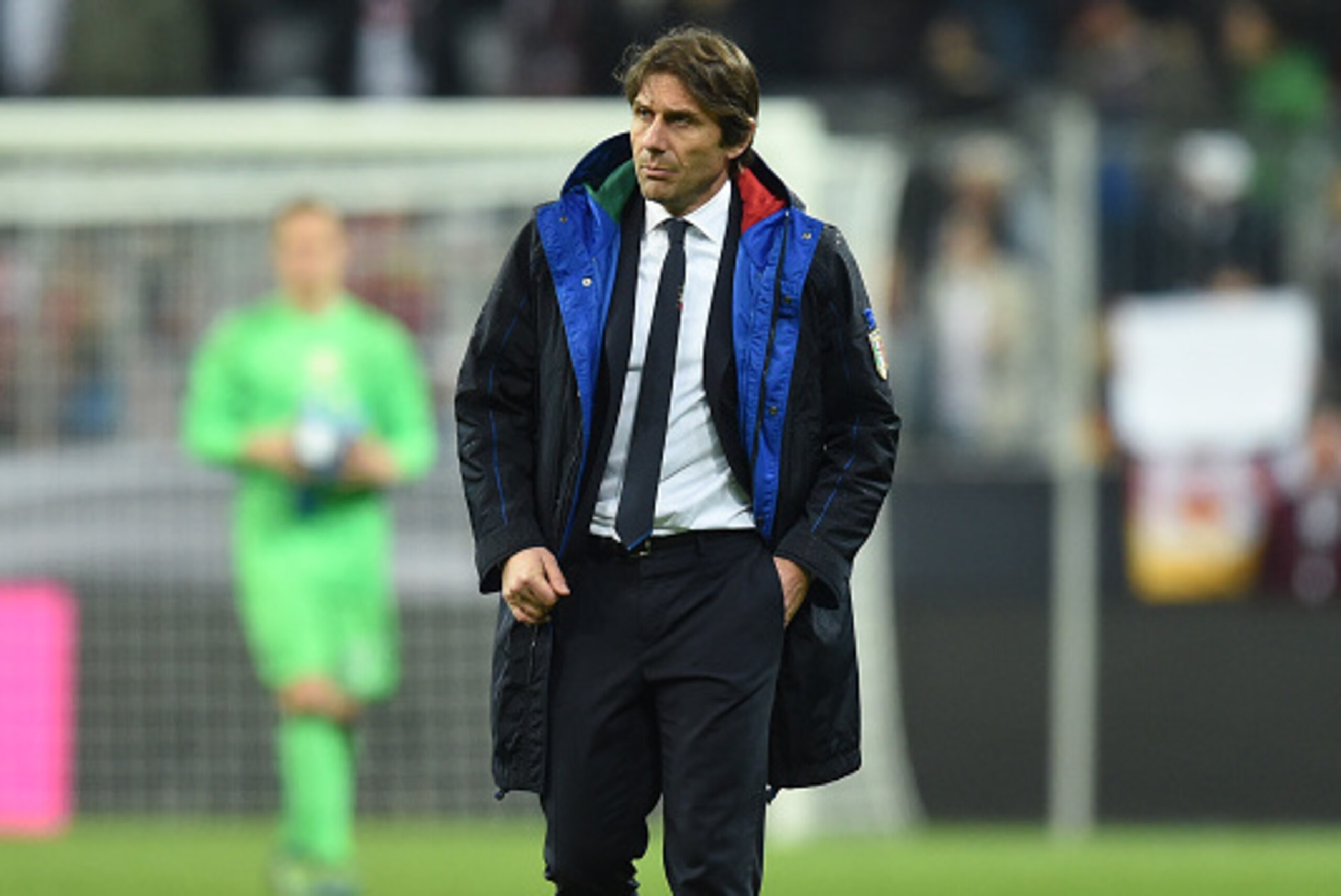 Italian headcoach Antonio Conte walks at the field after a friendly football match Germany vs Italy in Muinch, southern Germany, on March 29, 2016.  / AFP / CHRISTOF STACHE        (Photo credit should read CHRISTOF STACHE/AFP/Getty Images)