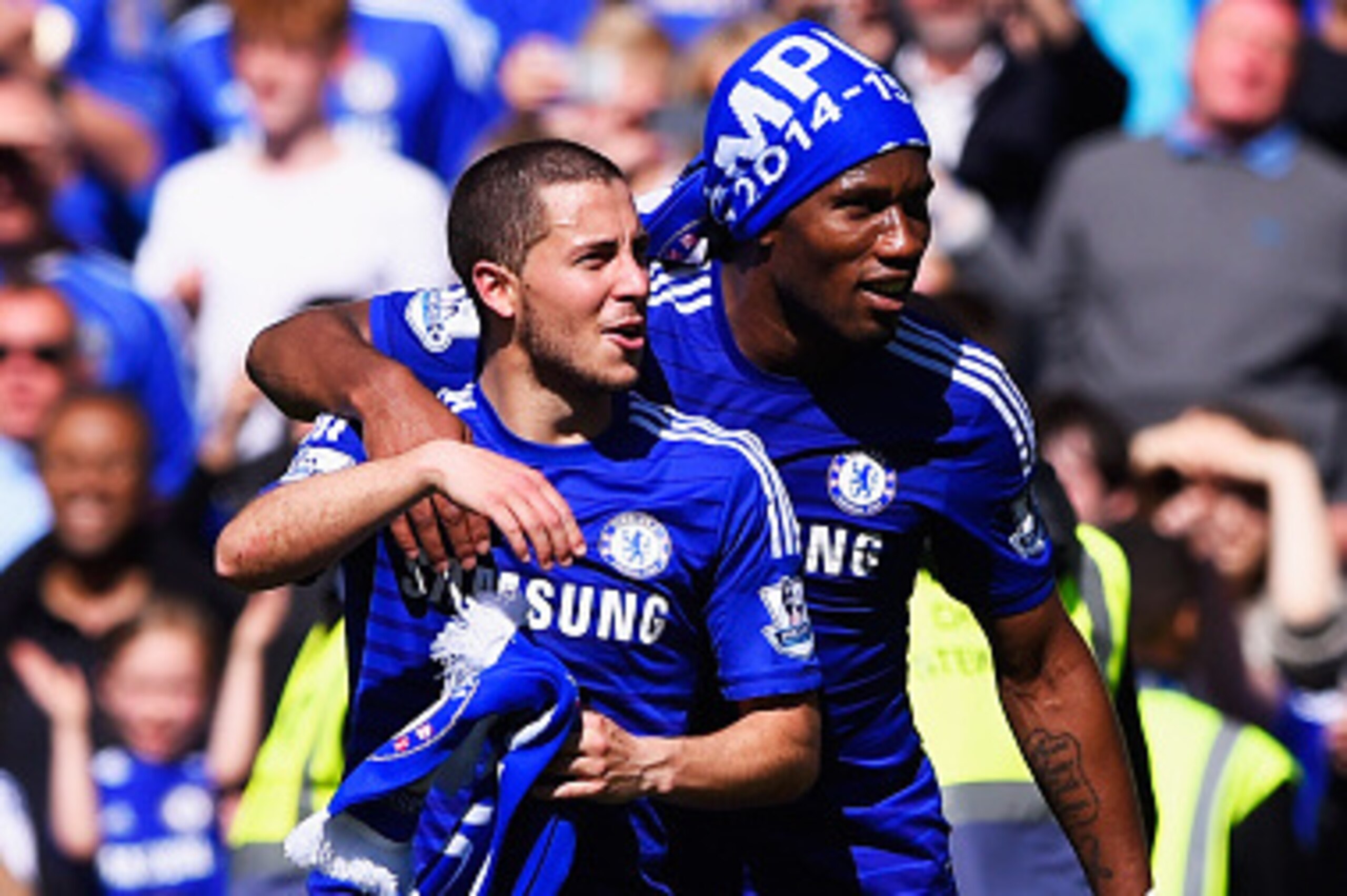 LONDON, ENGLAND - MAY 03:  Eden Hazard (L) and Didier Drogba of Chelsea celebrate winning the Premier League title after the Barclays Premier League match between Chelsea and Crystal Palace at Stamford Bridge on May 3, 2015 in London, England. Chelsea bec
