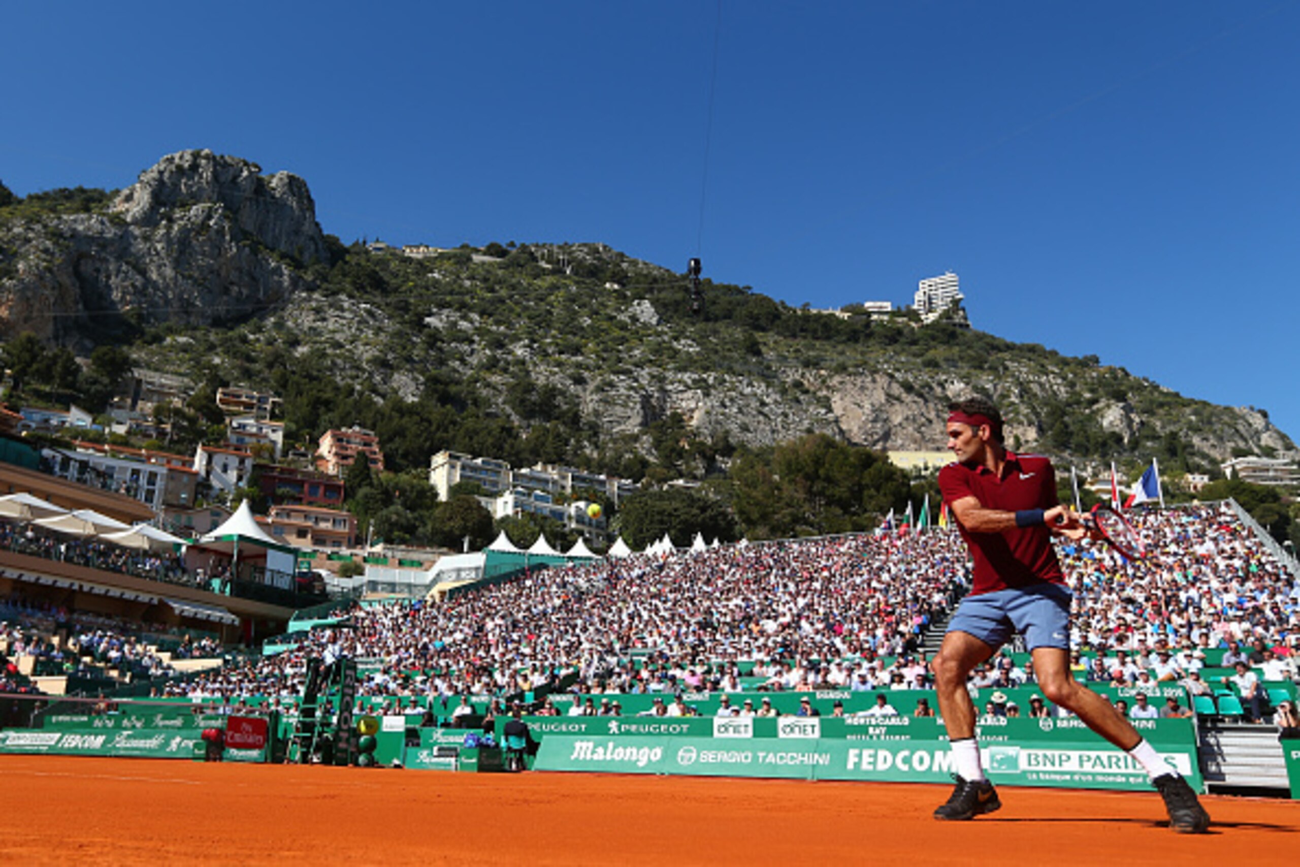 MONTE-CARLO, MONACO - APRIL 12: Roger Federer of Switzerland hits a backhand during the second round match against Guillermo Garcia-Lopez of Spain on day three of the Monte Carlo Rolex Masters at Monte-Carlo Sporting Club on April 12, 2016 in Monte-Carlo MONTE-CARLO, MONACO - APRIL 12: Roger Federer of Switzerland hits a backhand during the second round match against Guillermo Garcia-Lopez of Spain on day three of the Monte Carlo Rolex Masters at Monte-Carlo Sporting Club on April 12, 2016 in Monte-Carlo