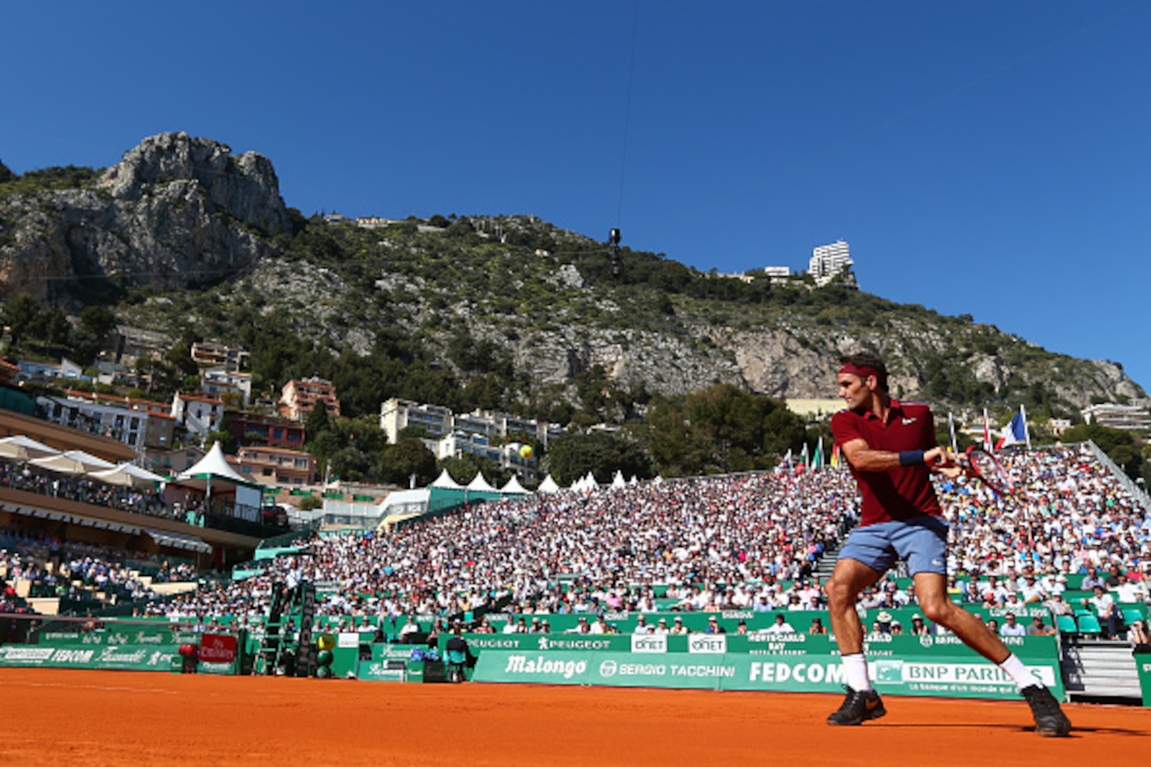 MONTE-CARLO, MONACO - APRIL 12:  Roger Federer of Switzerland hits a backhand during the second round match against Guillermo Garcia-Lopez of Spain on day three of the Monte Carlo Rolex Masters at Monte-Carlo Sporting Club on April 12, 2016 in Monte-Carlo