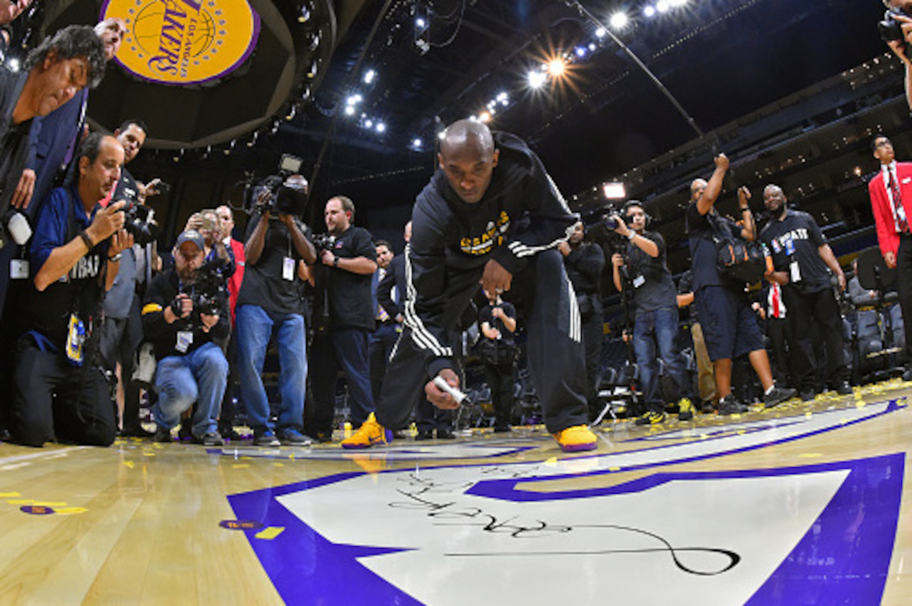 LOS ANGELES, CA - APRIL 13: Kobe Bryant #24 of the Los Angeles Lakers signs the court after the game against the Utah Jazz on April 13, 2016 at Staples Center in Los Angeles, California. NOTE TO USER: User expressly acknowledges and agrees that, by downl LOS ANGELES, CA - APRIL 13: Kobe Bryant #24 of the Los Angeles Lakers signs the court after the game against the Utah Jazz on April 13, 2016 at Staples Center in Los Angeles, California. NOTE TO USER: User expressly acknowledges and agrees that, by downl