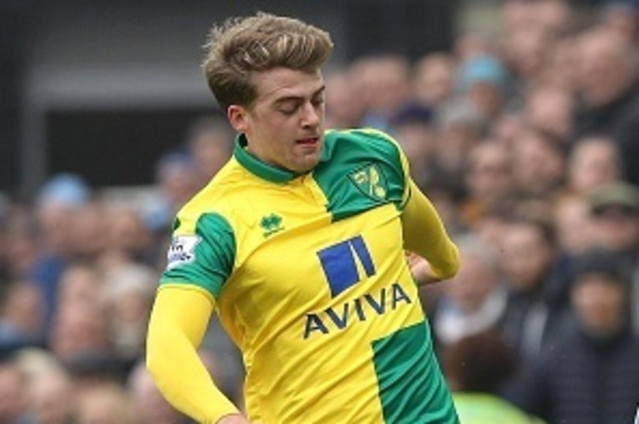 Norwich City's English striker Patrick Bamford (L) vies with Manchester City's Spanish midfielder David Silva during the English Premier League football match between Norwich City and Manchester City at Carrow Road in Norwich, eastern England, on March 12