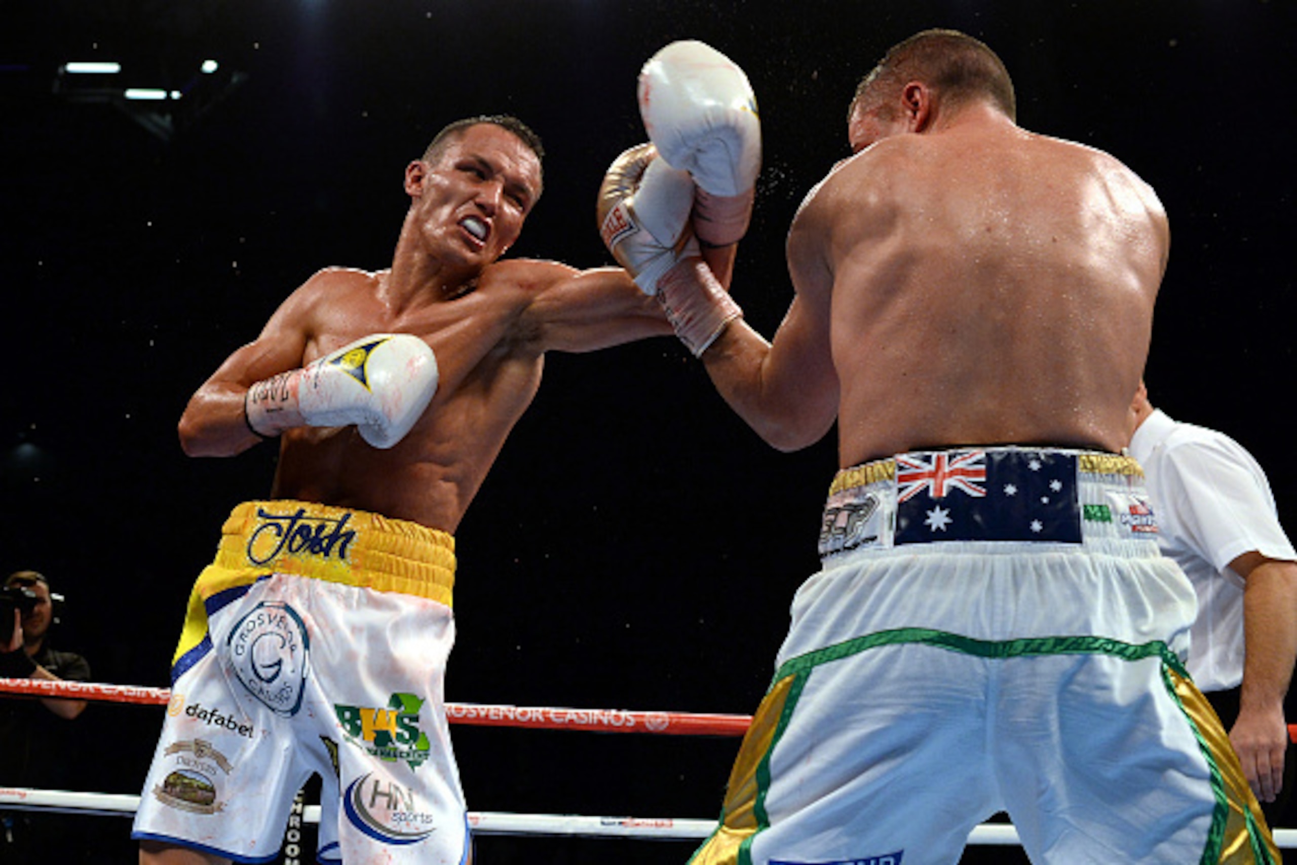 LEEDS, ENGLAND - SEPTEMBER 05:  Josh Warrington (L) in action against Joel Brunker during their Commonwealth and WBC International Featherweight title boxing contest at First Direct Arena on September 5, 2015 in Leeds, England.  (Photo by Nigel Roddis/Get