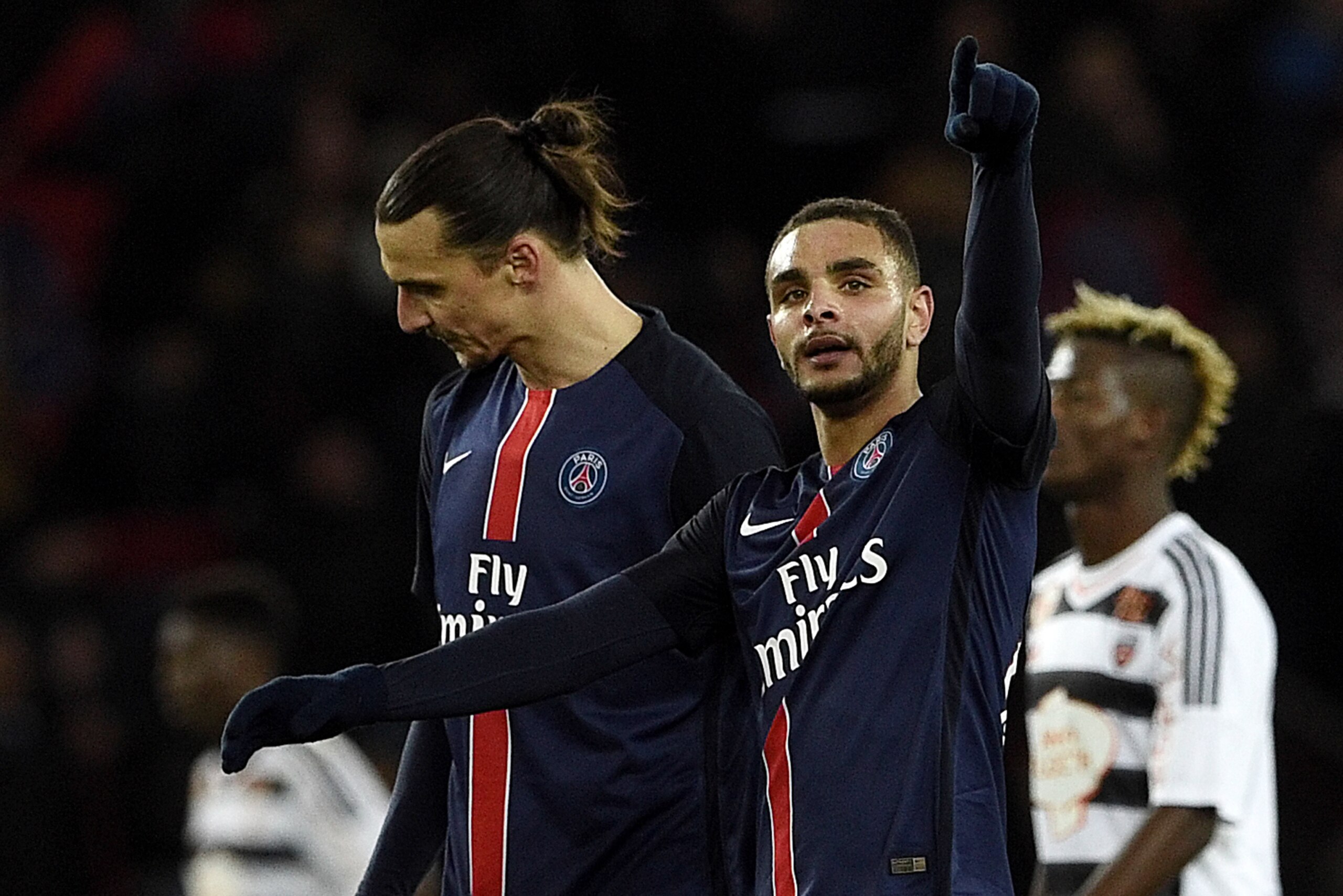 Paris Saint-Germain's French defender Layvin Kurzawa(L) celebrates a goal during the French L1 football match between Paris Saint-Germain (PSG) vs Lorient on February 3, 2016 at the Parc des Princes stadium in Paris. / AFP / FRANCK FIFE (Photo cre Paris Saint-Germain's French defender Layvin Kurzawa(L) celebrates a goal during the French L1 football match between Paris Saint-Germain (PSG) vs Lorient on February 3, 2016 at the Parc des Princes stadium in Paris. / AFP / FRANCK FIFE (Photo cre
