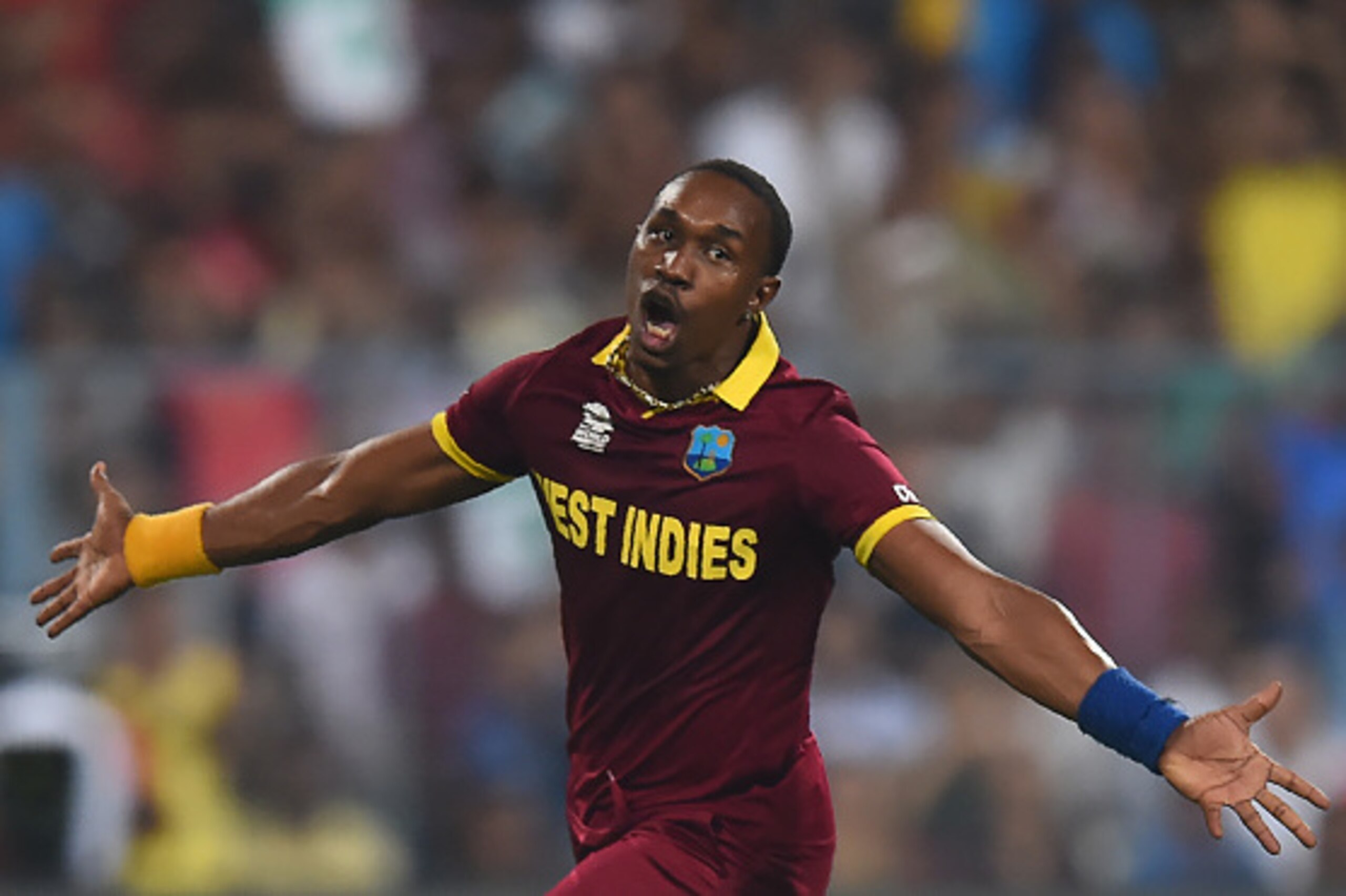West Indies's Dwayne Bravo celebrates the wicket England's Moeen Ali during the World T20 cricket tournament final match between England and West Indies at The Eden Gardens Cricket Stadium in Kolkata on April 3, 2016.   / AFP / DIBYANGSHU SARKAR        (P