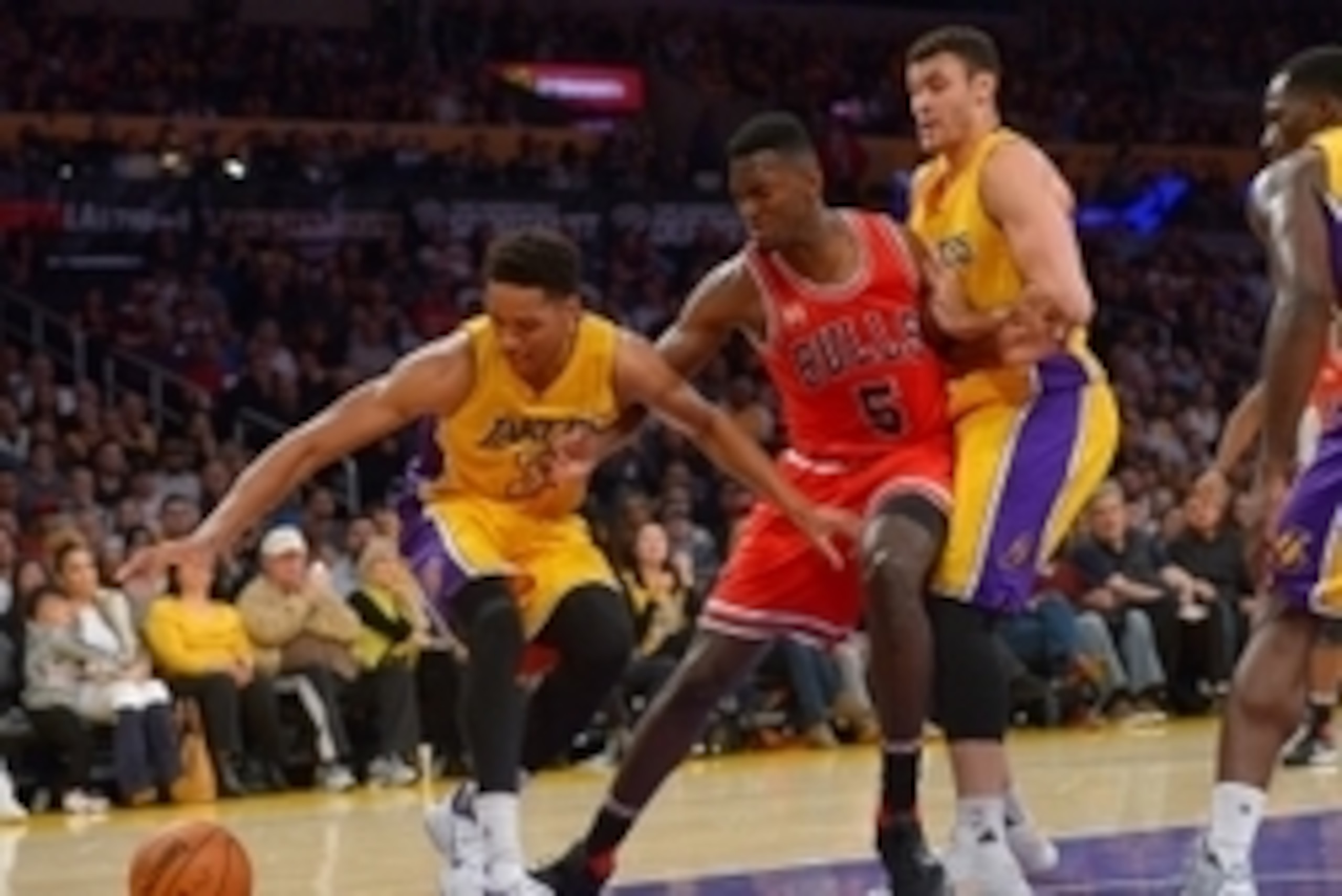 Jan 28, 2016; Los Angeles, CA, USA; Chicago Bulls forward Bobby Portis (5), Los Angeles Lakers forward Larry Nance Jr. (7) and forward Anthony Brown (3) battle for a loose ball in the second half at Staples Center. The Bulls won 114-91. Mandatory Credit: 