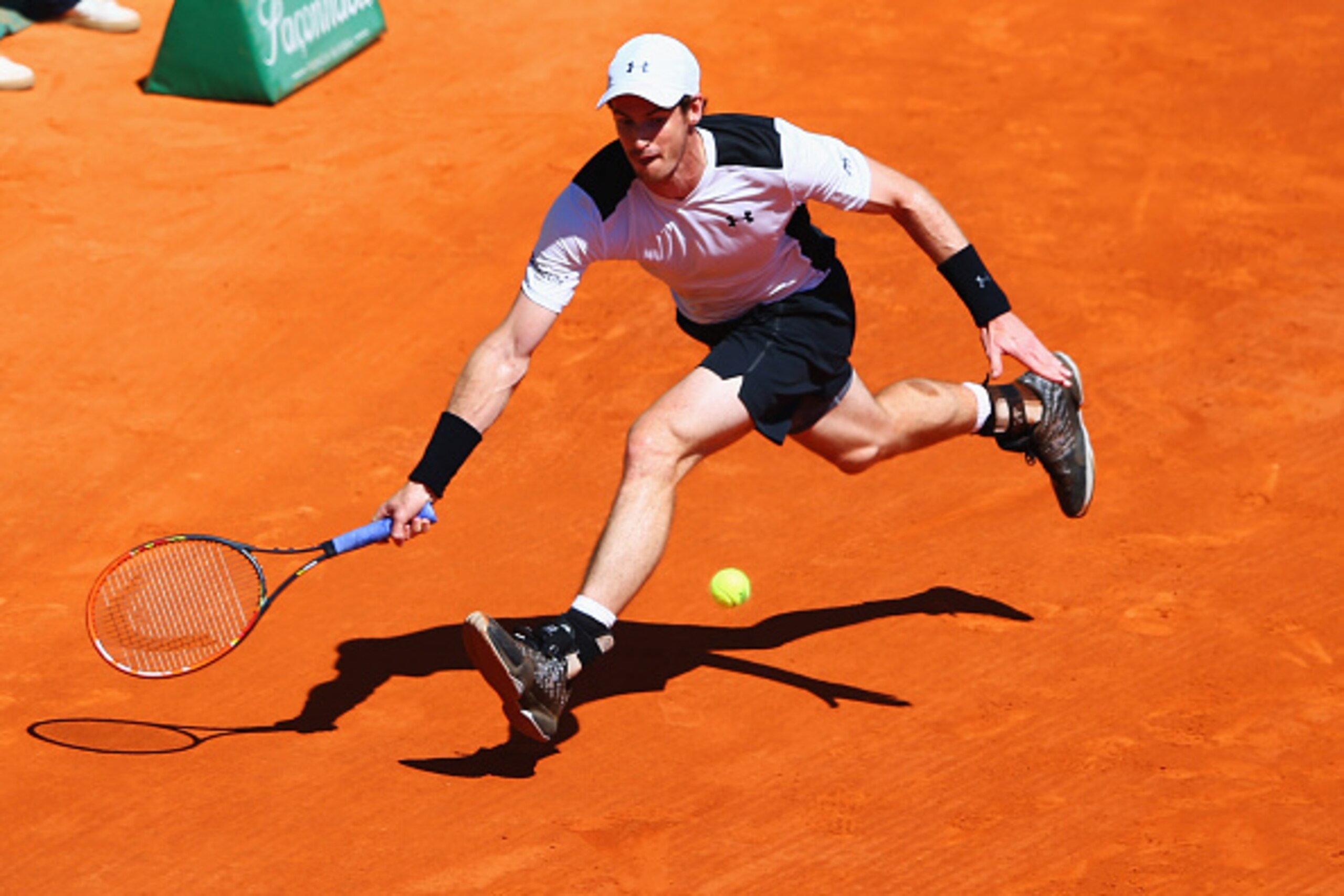 MONTE-CARLO, MONACO - APRIL 14:  Andy Murray of Great Britain stretches to hit a forehand during the round three match against Benoit Paire of France on day five of Monte Carlo Rolex Masters at Monte-Carlo Sporting Club on April 14, 2016 in Monte-Carlo, M