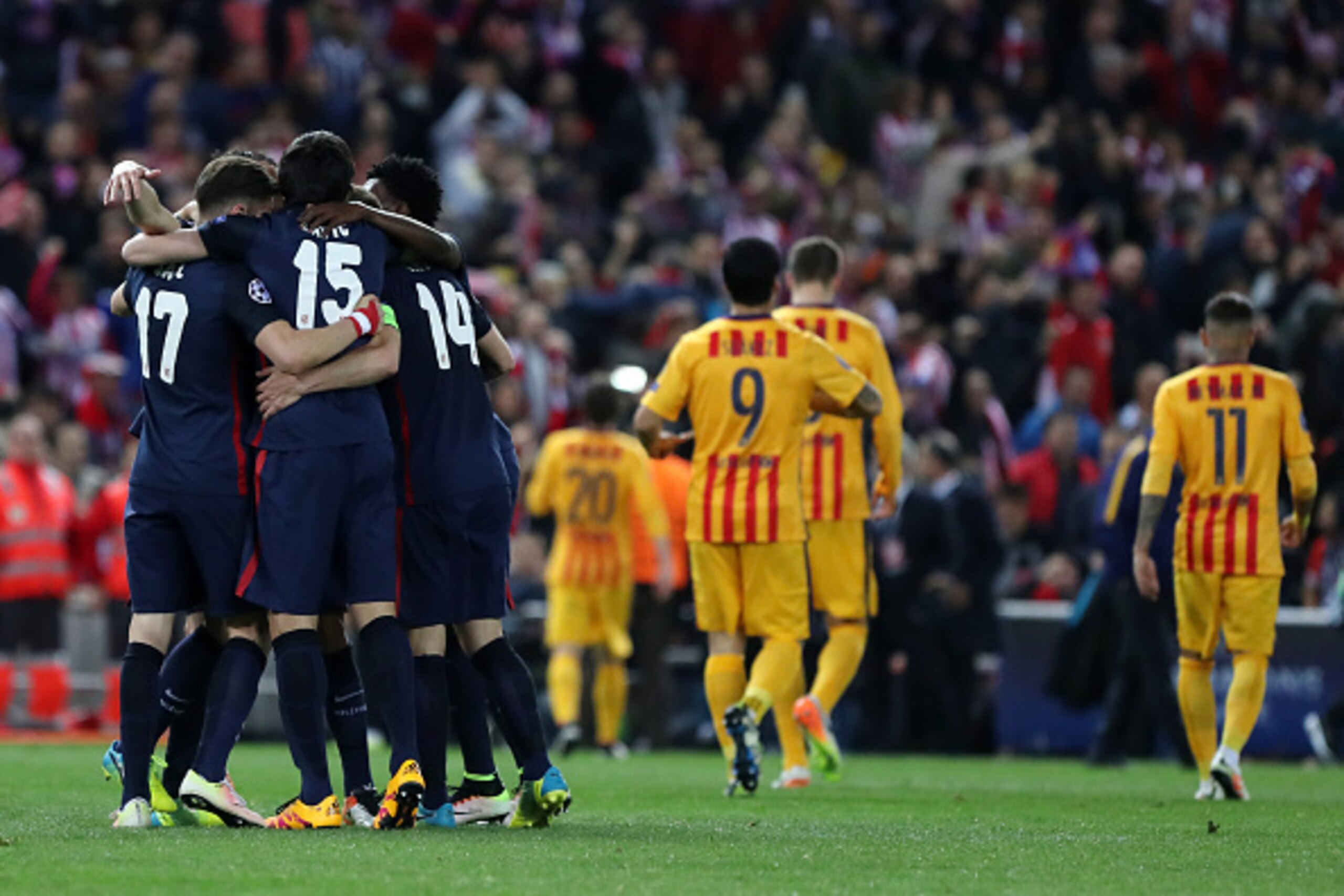 Atletico Madrid's (L) players celebrate their win after the Champions League quarter-final second leg football match Club Atletico de Madrid VS FC Barcelona at the Vicente Calderon stadium in Madrid on April 13, 2016. Atletico de Madrid won 2-0. / AFP / C Atletico Madrid's (L) players celebrate their win after the Champions League quarter-final second leg football match Club Atletico de Madrid VS FC Barcelona at the Vicente Calderon stadium in Madrid on April 13, 2016. Atletico de Madrid won 2-0. / AFP / C