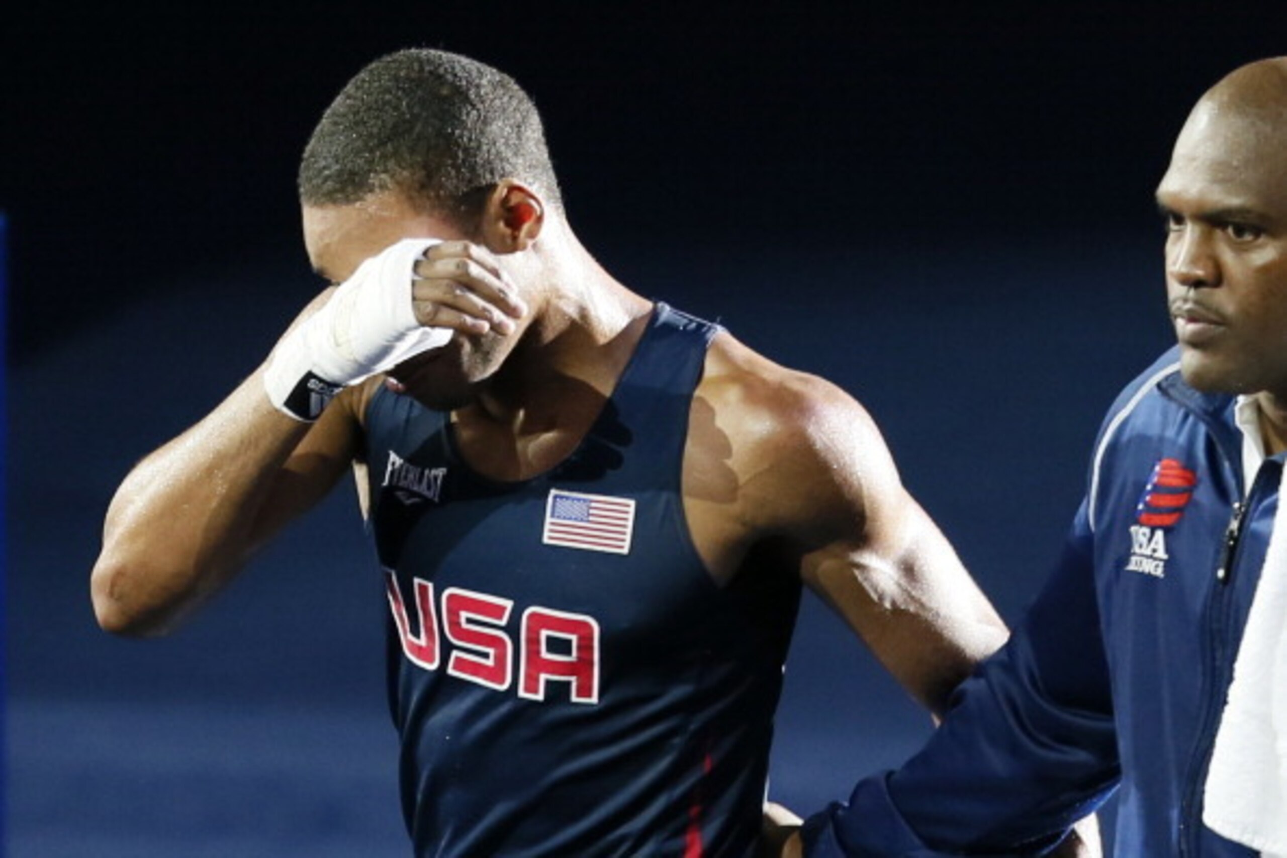 Errol Spence of the USA fights back tears as he leaves the ring following his defeat against Krishan Vikas of India in their round of 16 Welterweight (69kg) match of the London 2012 Olympic Games at the ExCel Arena on August 3, 2012 in London.  Vikas was 