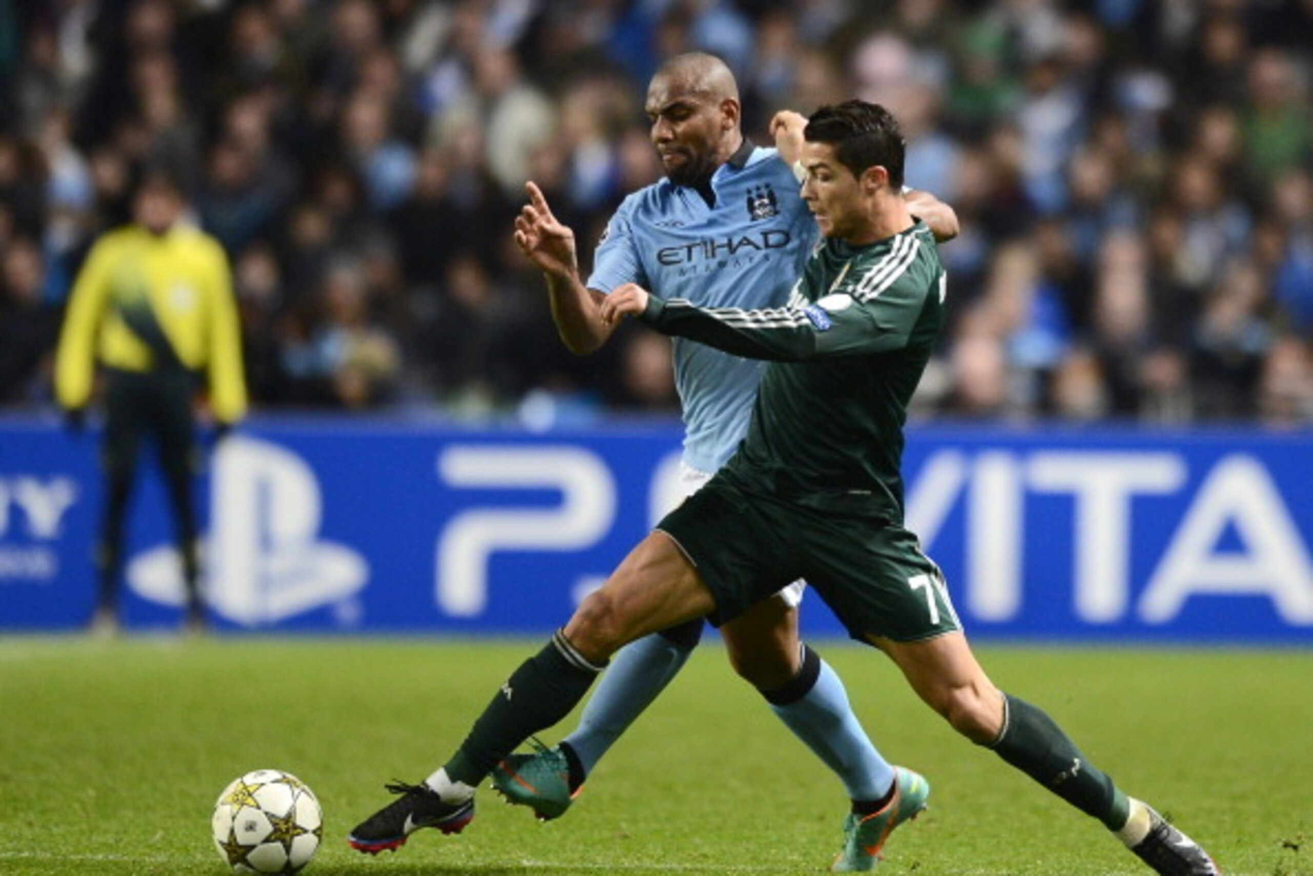 Real Madrid's Portuguese forward Cristiano Ronaldo (R) vies with Manchester City's Brazilian defender Maicon during the UEFA Champions League group D football match between Manchester City and Real Madrid at The Etihad Stadium in Manchester, north-west En
