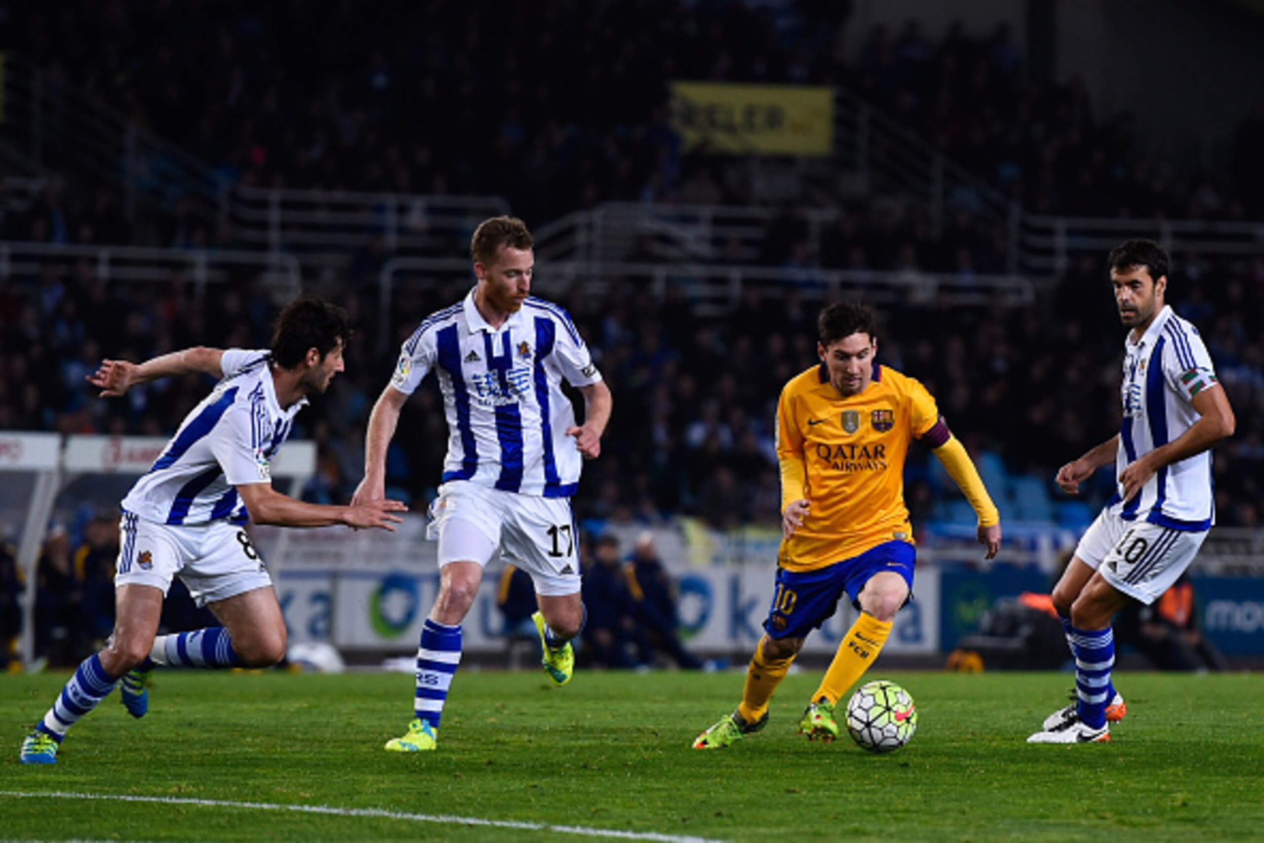 SAN SEBASTIAN, SPAIN - APRIL 09:  Lionel Messi of FC Barcelona competes for the ball with Esteban Granero (L) David Zurutuza Veillet (2ndL) and Xabier Prieto Argarate of Real Sociedad the La Liga match between Real Sociedad de Futbol and FC Barcelona at E