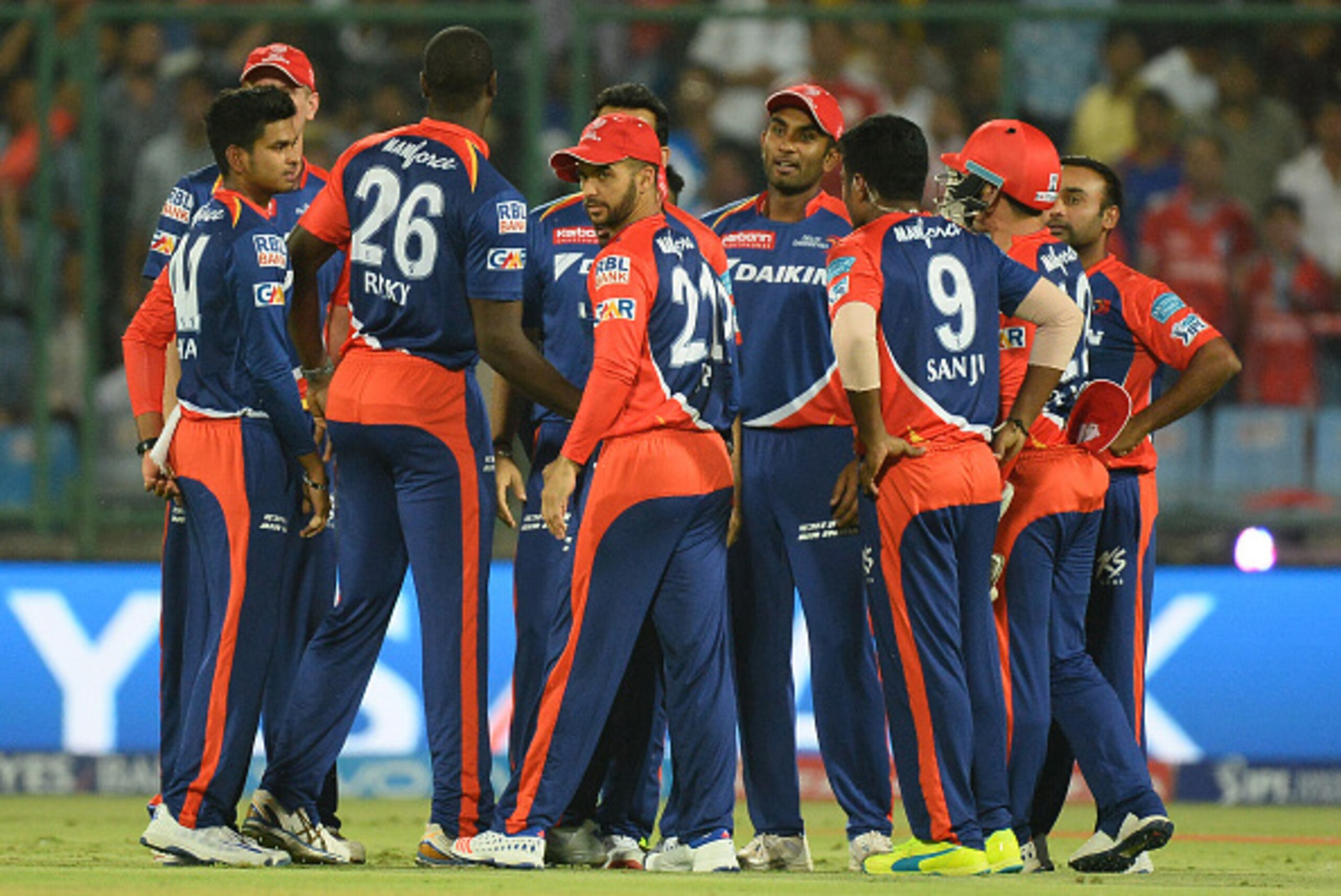 Delhi Daredevils cricketers celebrate the dismissal of unseen Kings XI Punjab batsman Murali Vijay during the 2016 Indian Premier League (IPL) Twenty20 cricket match between Delhi Daredevils and Kings XI Punjab at The Feroz Shah Kotla Cricket Stadium in N