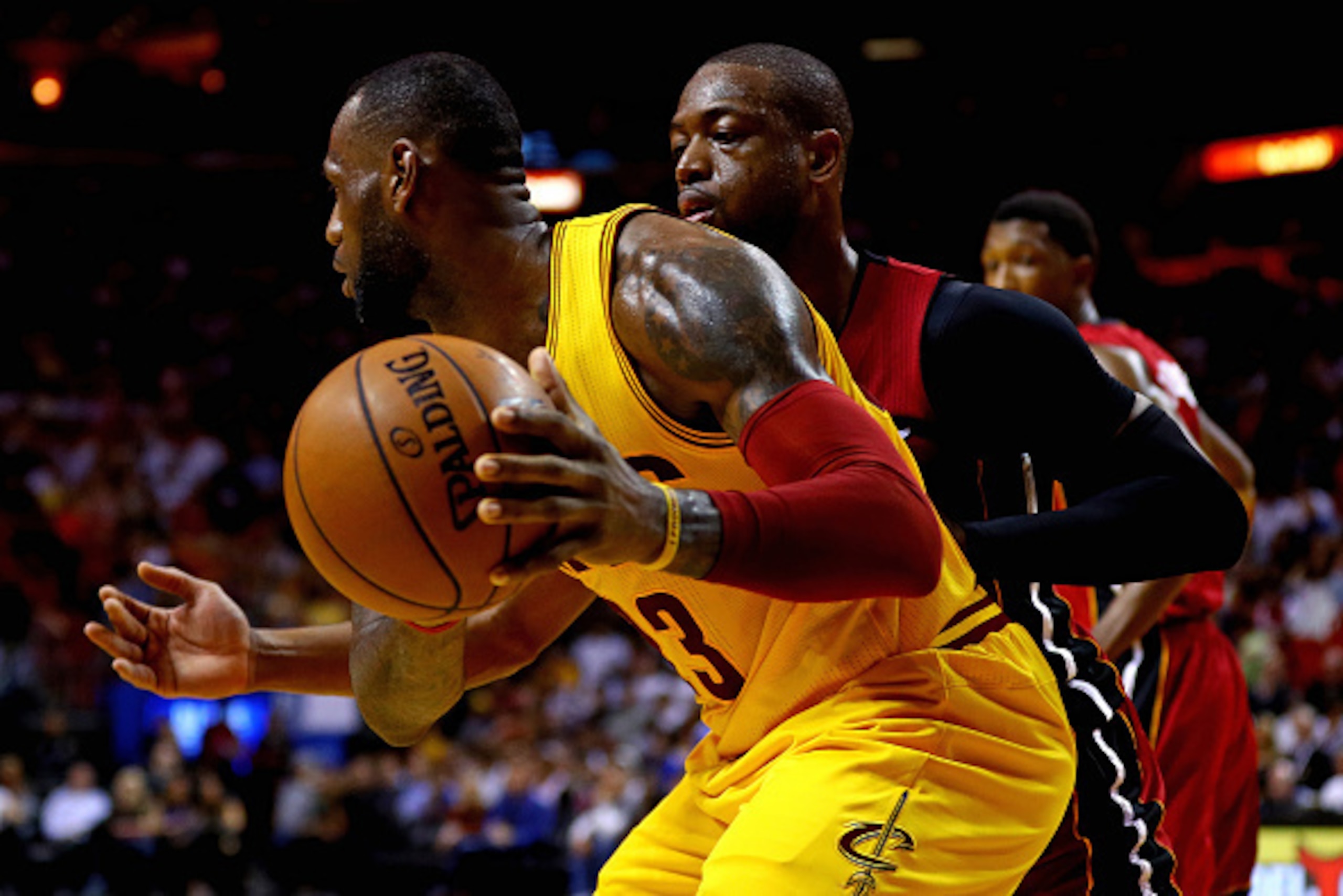 MIAMI, FL - MARCH 19: LeBron James #23 of the Cleveland Cavaliers posts up Dwyane Wade #3 of the Miami Heat  during a game  at American Airlines Arena on March 19, 2016 in Miami, Florida.  NOTE TO USER: User expressly acknowledges and agrees that, by down
