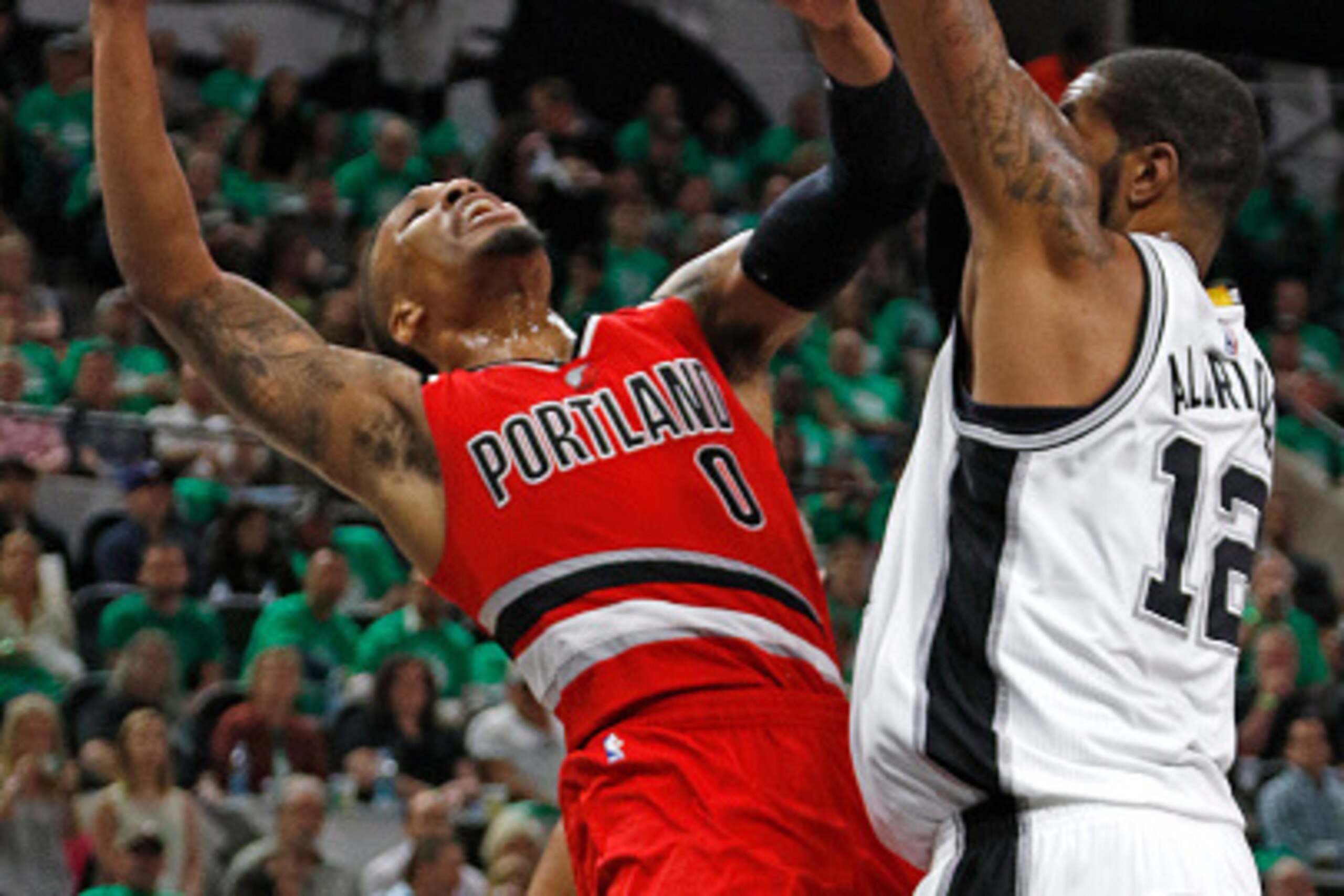 SAN ANTONIO,TX - MARCH 17: Damian Lillard #0 of the Portland Trail Blazers has his shot blocked by LaMarcus Aldridge  #12 of the San Antonio Spurs at AT&T Center on March 17, 2016 in San Antonio, Texas.  NOTE TO USER: User expressly acknowledges and agree