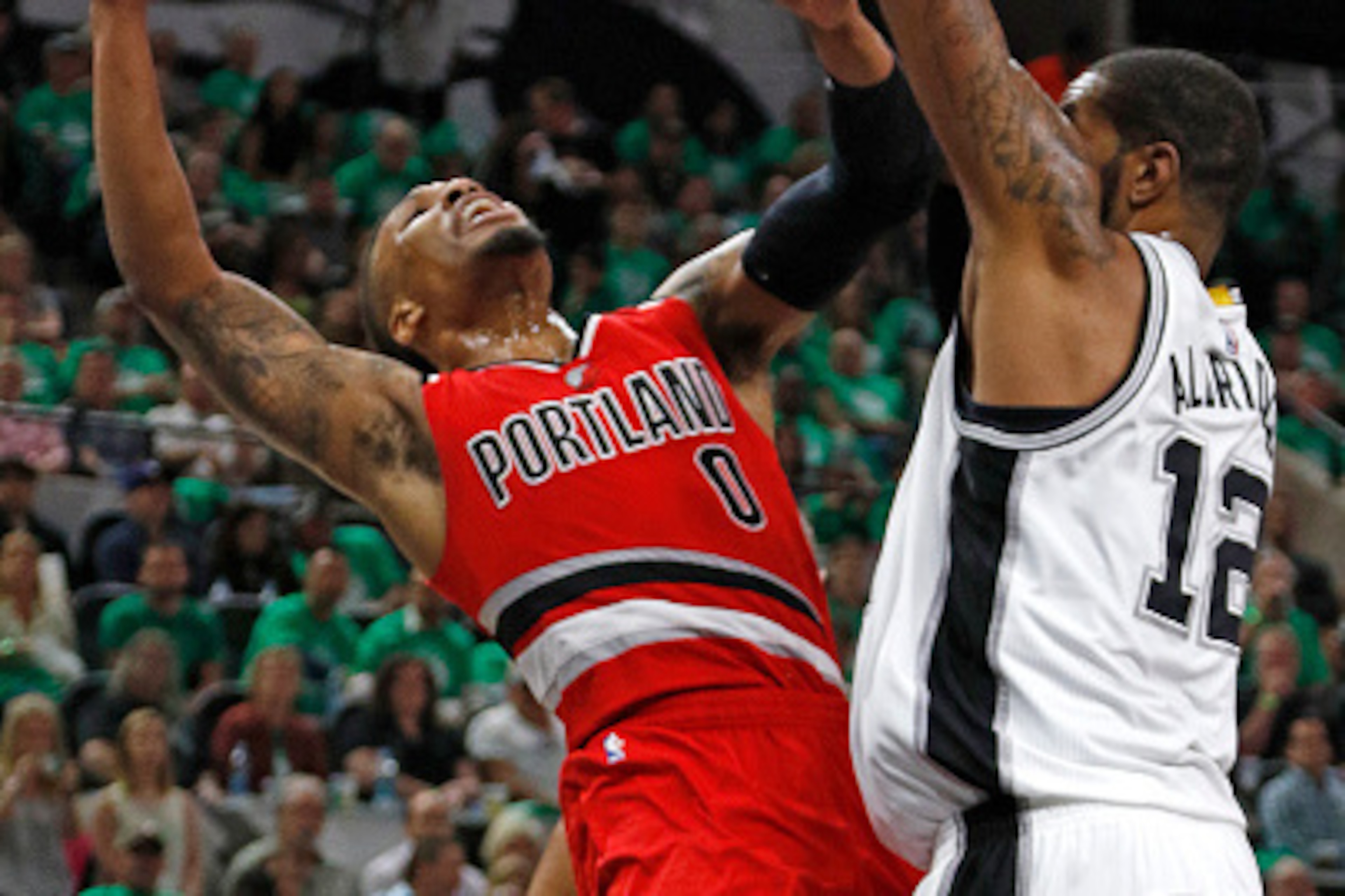 SAN ANTONIO,TX - MARCH 17: Damian Lillard #0 of the Portland Trail Blazers has his shot blocked by LaMarcus Aldridge  #12 of the San Antonio Spurs at AT&T Center on March 17, 2016 in San Antonio, Texas.  NOTE TO USER: User expressly acknowledges and agree
