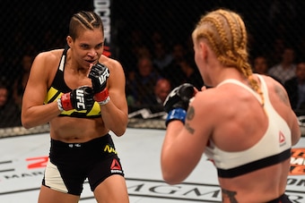LAS VEGAS, NV - MARCH 05: (L-R) Amanda Nunes of Brazil and Valentina Shevchenko of Peru face off in their women's bantamweight bout during the UFC 196 event inside MGM Grand Garden Arena on March 5, 2016 in Las Vegas, Nevada.  (Photo by Josh Hedges/Zuffa 