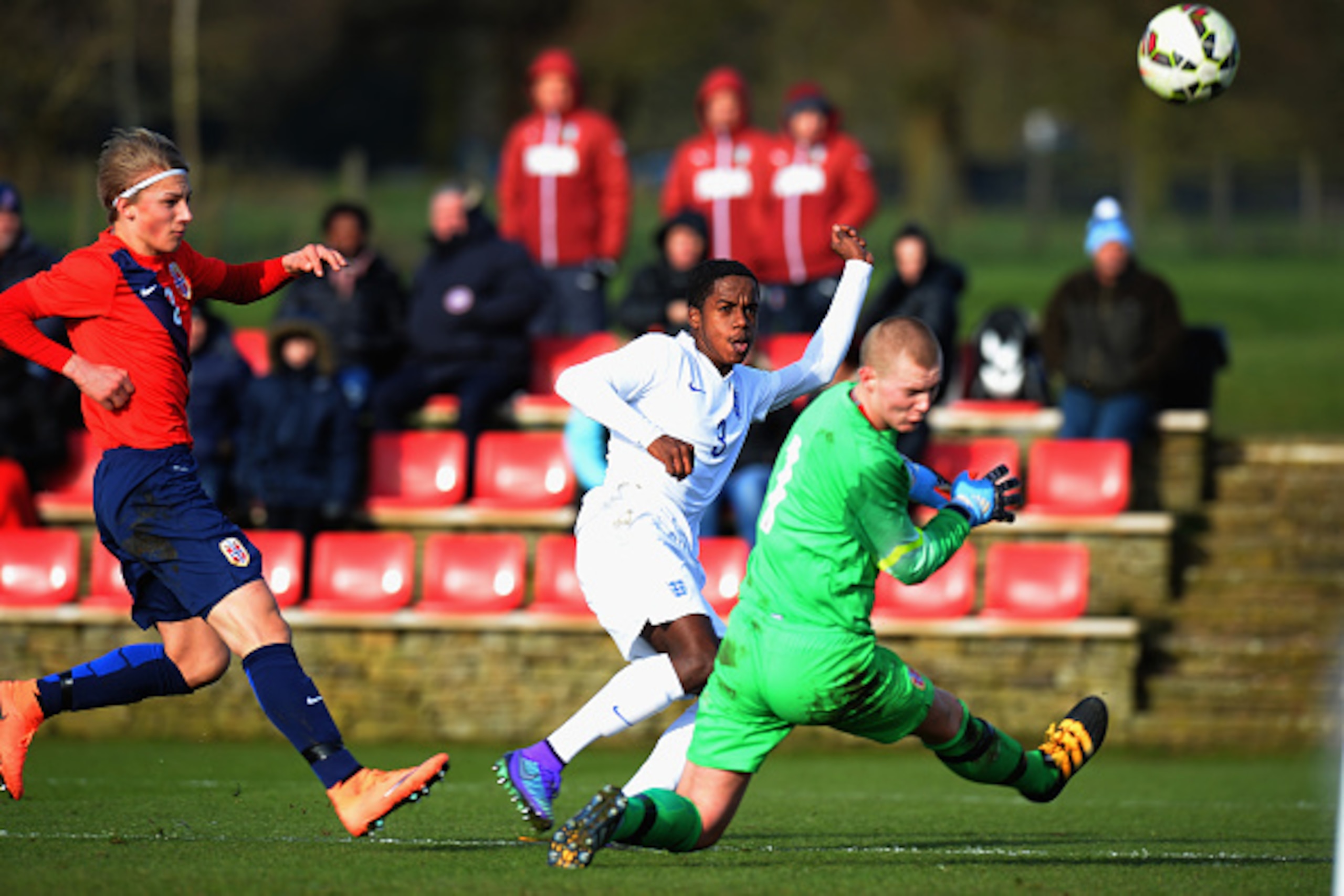 BURTON-UPON-TRENT, ENGLAND - FEBRUARY 16:  Ryan Sessegnon of England U16 shoots at goal past Kristoffer Klaesson of Norway U16 during the U16s International Friendly match between England U16 and Norway U16 at St Georges Park on February 16, 2016 in Burto
