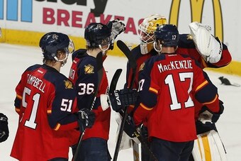 SUNRISE, FL - APRIL 15: Goaltender Roberto Luongo #1 of the Florida Panthers is congratulated by teammates after the end of get game against the New York Islanders in Game Two of the Eastern Conference Quarterfinals during the NHL 2016 Stanley Cup Playoff
