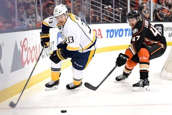 ANAHEIM, CA - APRIL 15:  Colin Wilson #33 of the Nashville Predators skates from Hampus Lindholm #47 of the Anaheim Ducks during the second period in Game One of the Western Conference Quarterfinals during the 2015 NHL Stanley Cup Playoffs at Honda Center