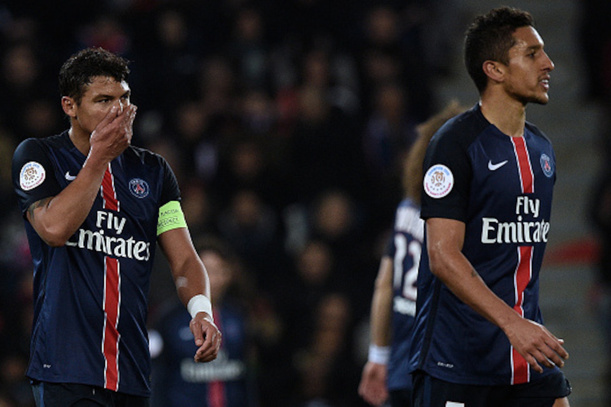 Paris Saint-Germain's Brazilian defenders Thiago Silva (L) and Marquinhos react after AS Monaco scored a goal during the French L1 football match between Paris Saint-Germain (PSG) and AS Monaco at the Parc des Princes stadium in Paris on March 20, 2016.  