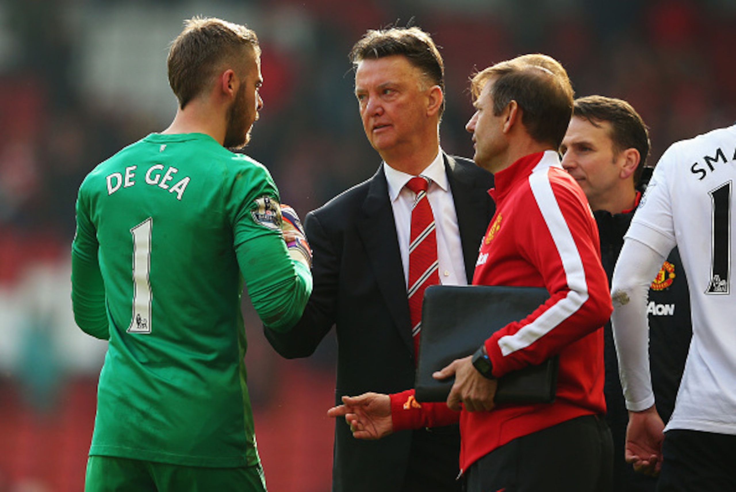 LIVERPOOL, ENGLAND - MARCH 22:  Louis van Gaal, manager of Manchester United celebrates victory with David De Gea of Manchester United after the Barclays Premier League match between Liverpool and Manchester United at Anfield on March 22, 2015 in Liverpoo