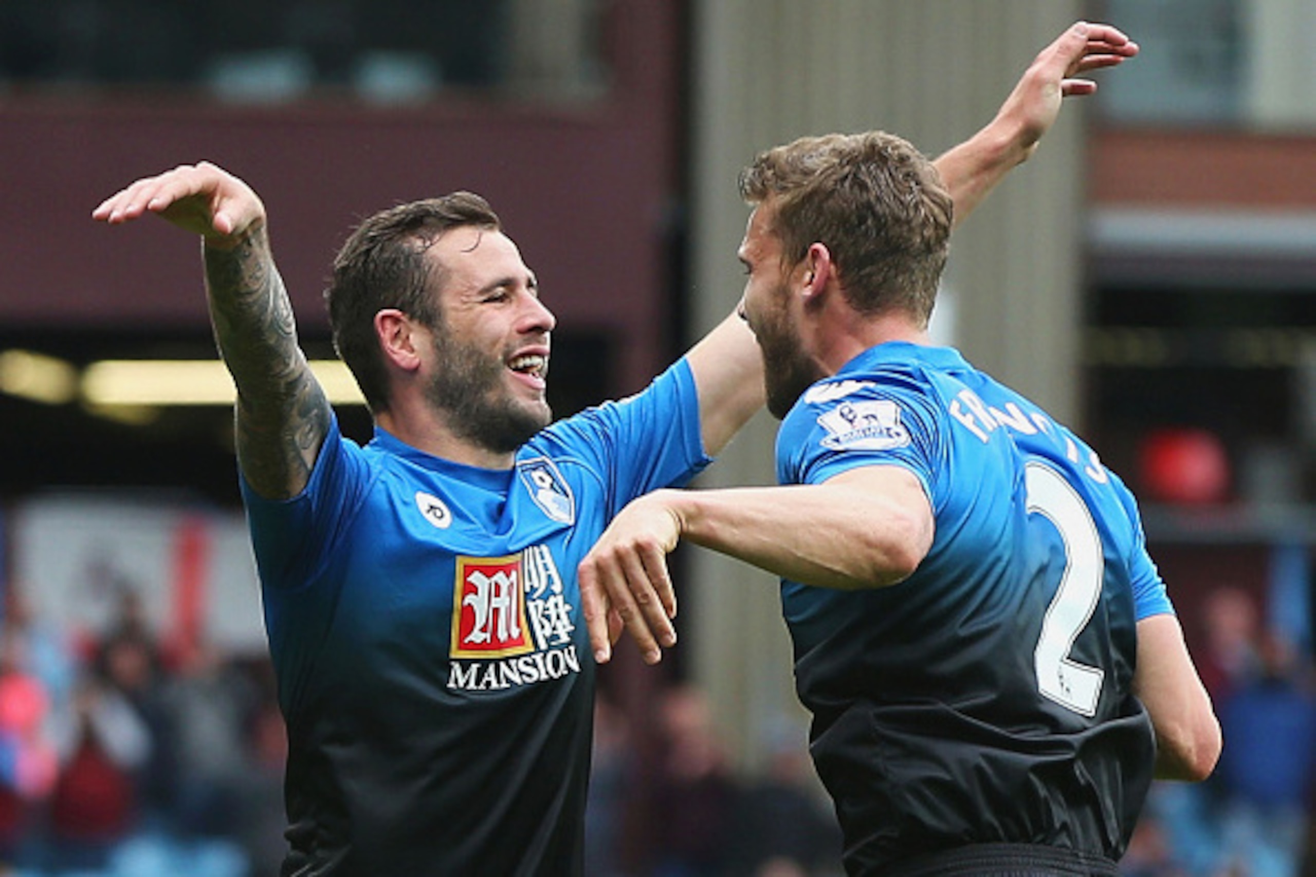 BIRMINGHAM, ENGLAND - APRIL 09:  Steve Cook (L) of Bournemouth celebrates scoring his team's first goal with his team mate Simon Francis (R) during the Barclays Premier League match between Aston Villa and A.F.C. Bournemouth at Villa Park on April 9, 2016