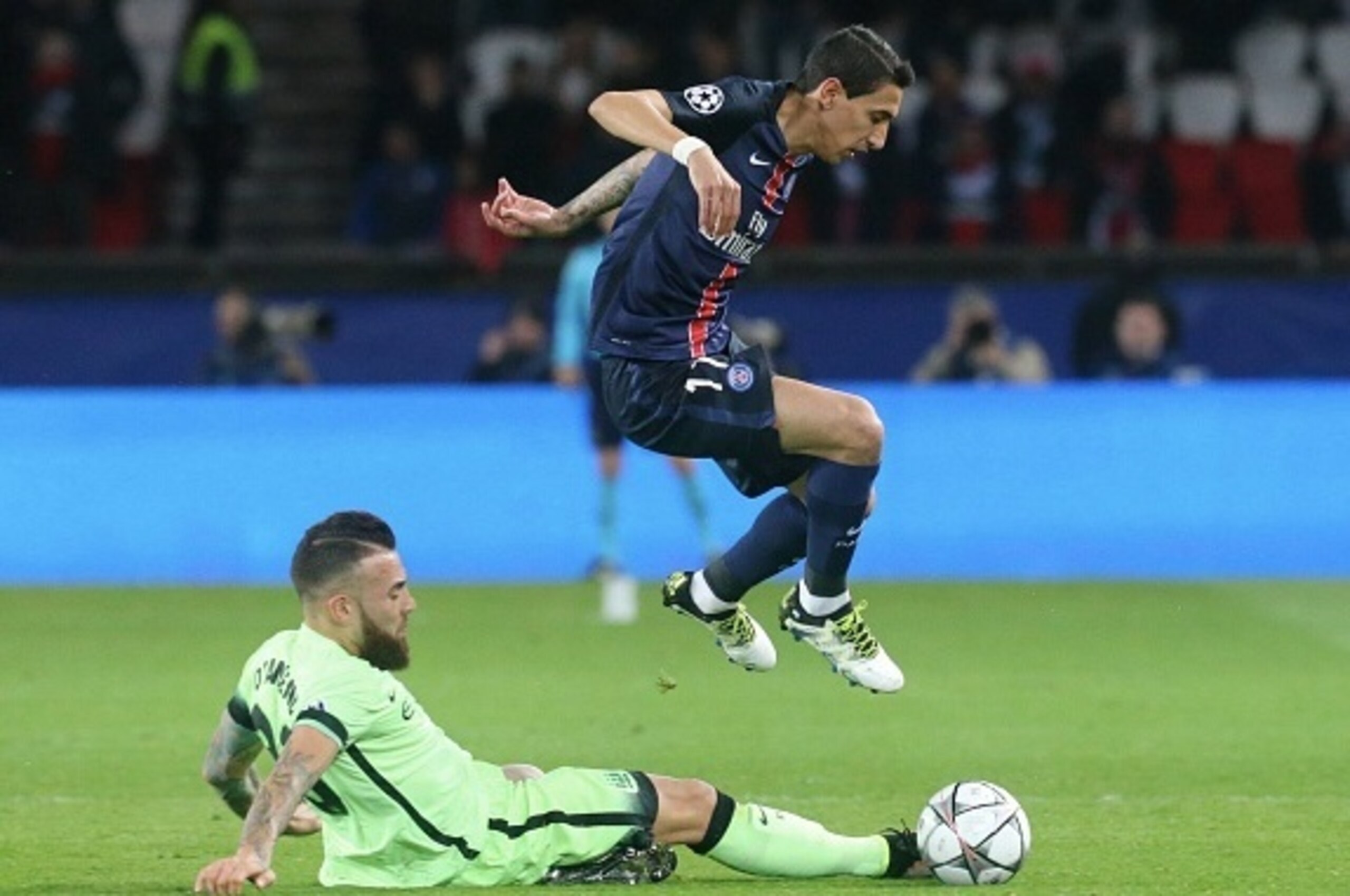 PARIS, FRANCE - APRIL 06:  Angel Di Maria of Paris Saint-Germain is tackle by Nicolas Otamendi of Manchester FC during the UEFA Champions League Quarter Final (first leg) between Paris Saint-Germain and Manchester City FC at Parc Des Princes on april 06, 