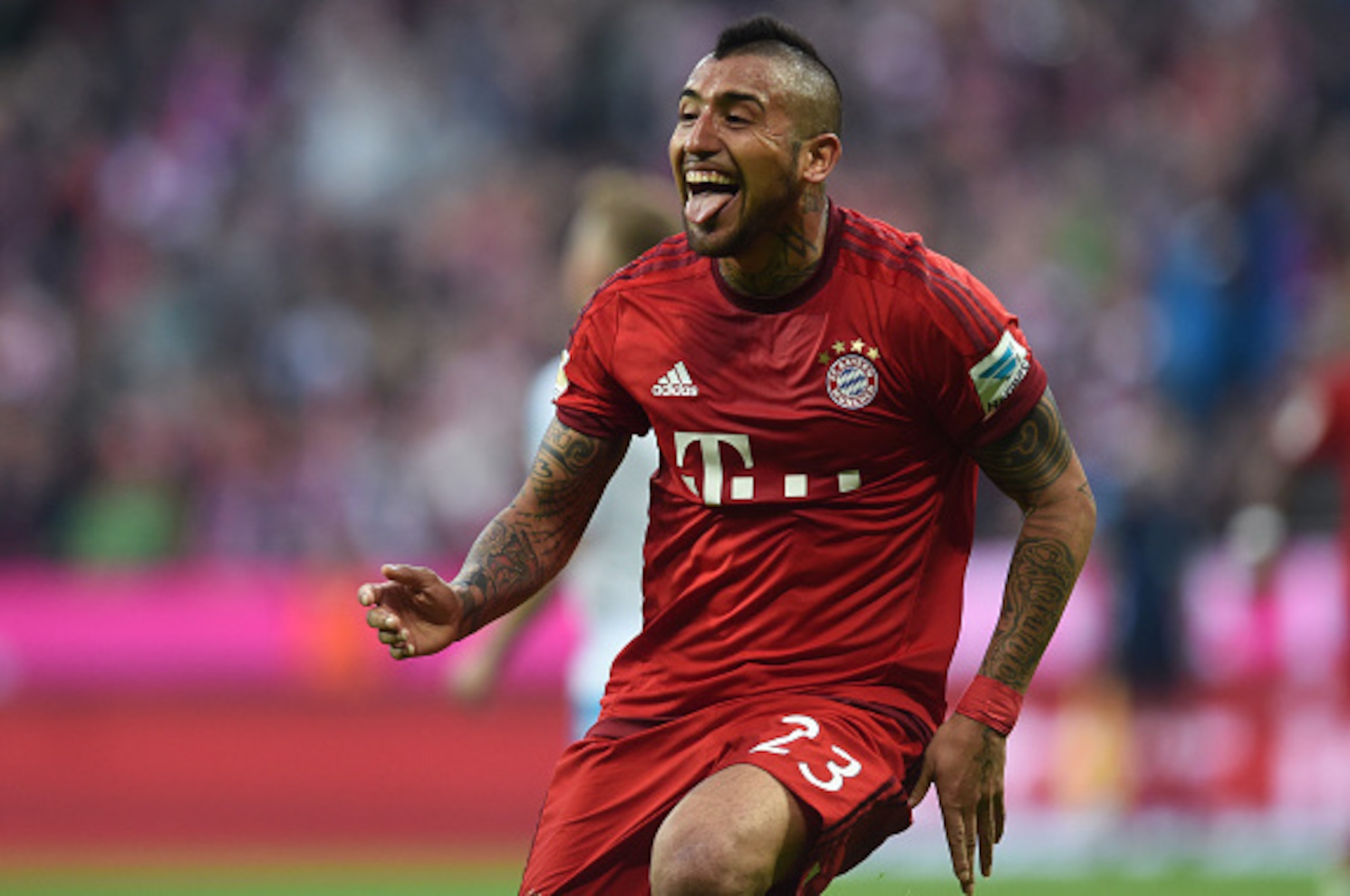 Bayern Munich's Chilian midfielder Arturo Vidal celebrates scoring the 3-0 goal during the German first division Bundesliga football match FC Bayern Munich vs Schalke 04 in Munich, southern Germany, on April 16, 2016.
Bayern Munich won the match 3-0. / AF