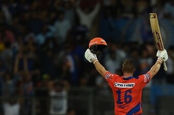 Gujarat Lions Aaron Finch celebrates after the winning runs during the 2016 Indian Premier League(IPL) Twenty20 cricket match between Gujarat Lions and Mumbai Indians at the Wankhede Stadium in Mumbai on April 16, 2016.  / AFP / INDRANIL MUKHERJEE / ----I