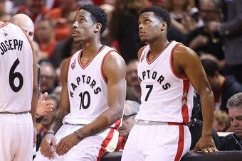 TORONTO, CANADA - APRIL 16: Kyle Lowry #7 (R) of the Toronto Raptors and DeMar DeRozan #10 (L) look on against the Indiana Pacers in Game One of the Eastern Conference Quarterfinals during the 2016 NBA Playoffs on April 16, 2016 at the Air Canada Centre i