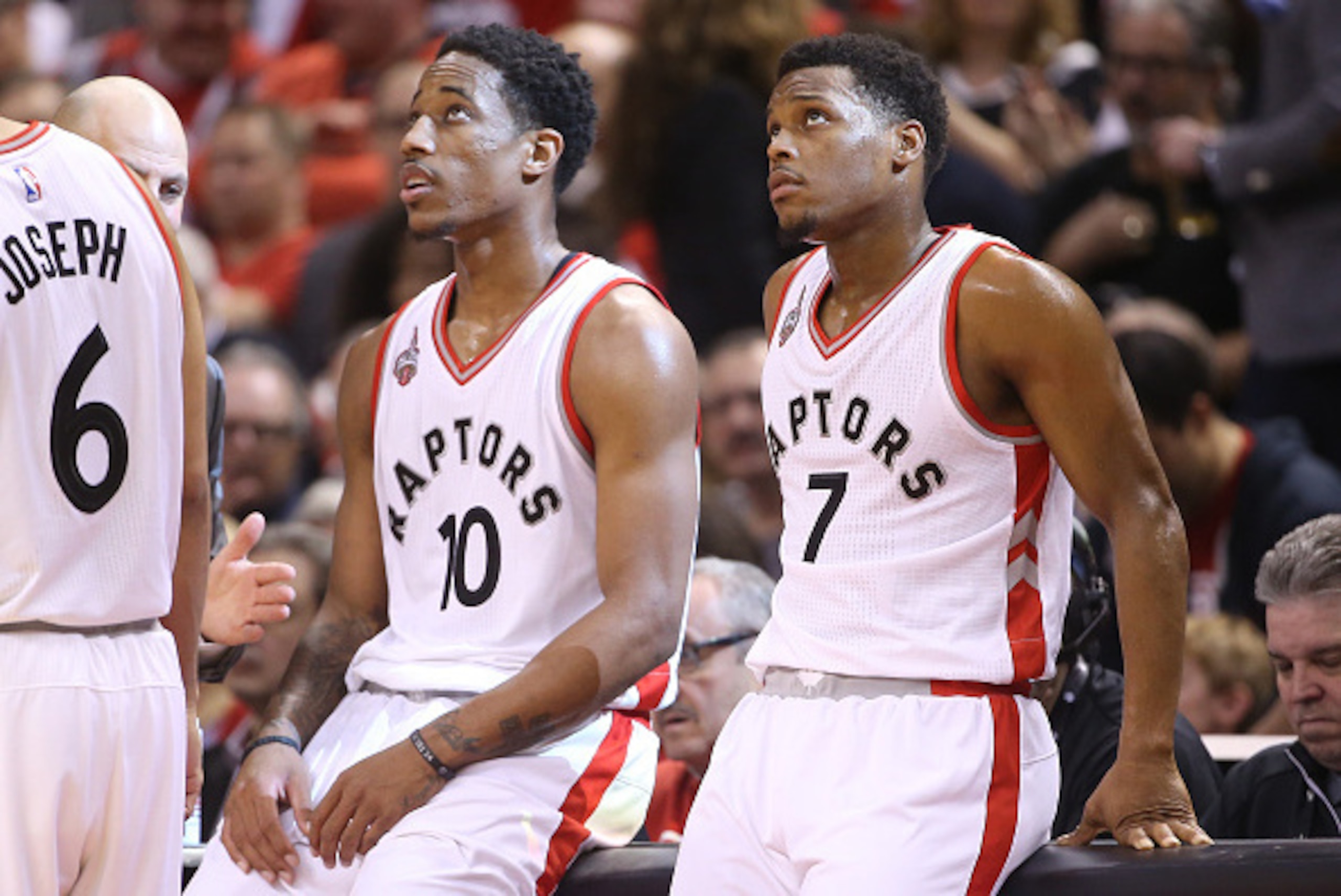 TORONTO, CANADA - APRIL 16: Kyle Lowry #7 (R) of the Toronto Raptors and DeMar DeRozan #10 (L) look on against the Indiana Pacers in Game One of the Eastern Conference Quarterfinals during the 2016 NBA Playoffs on April 16, 2016 at the Air Canada Centre i