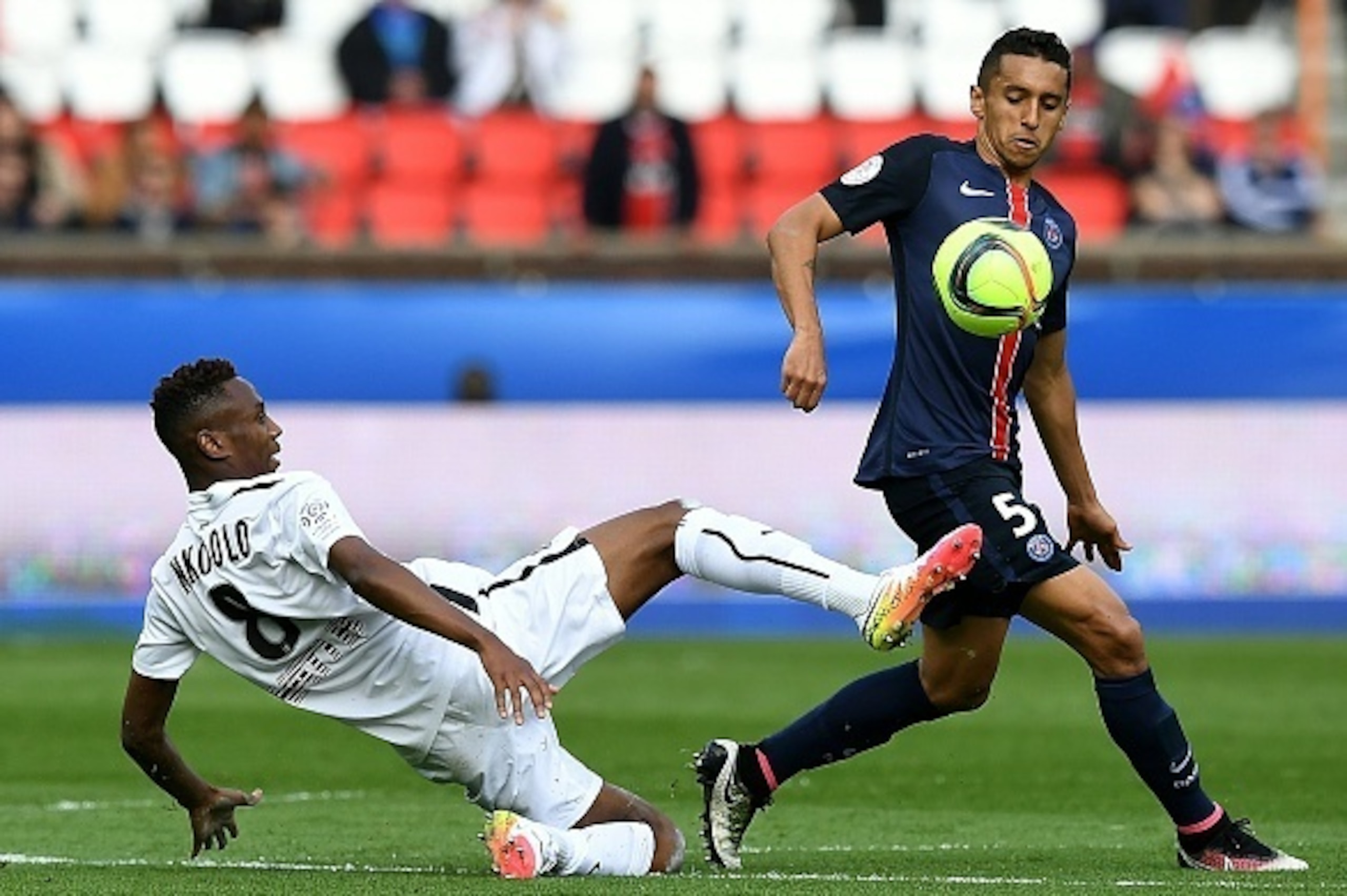 Paris Saint-Germain's Brazilian defender Marquinhos (R) vies with Caen's French midfielder Jordan Nkololo during the French L1 football match between Paris Saint-Germain and Caen at the Parc des Princes stadium in Paris on April 16, 2016. AFP PHOTO / FRAN