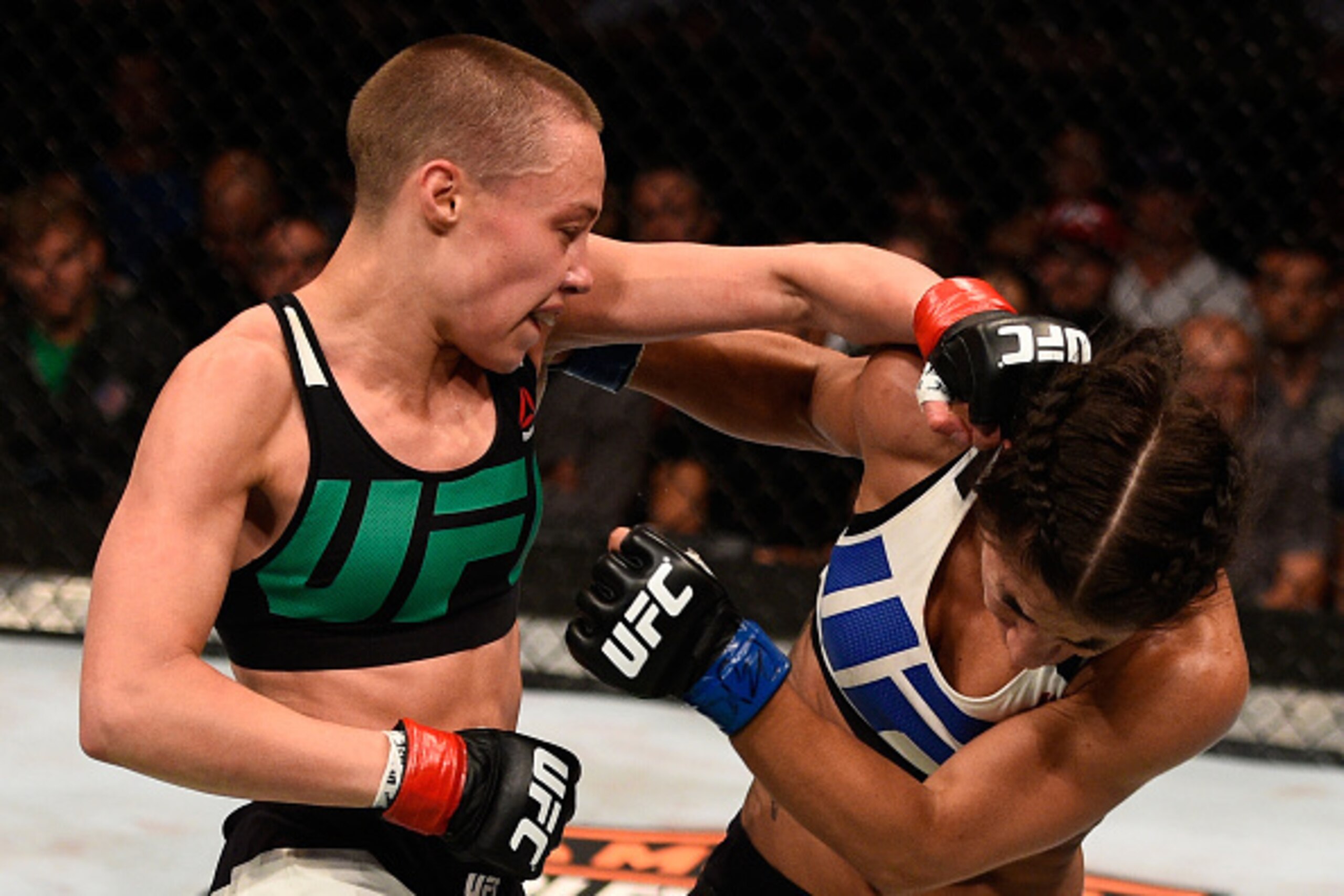 TAMPA, FL - APRIL 16:  (L-R) Rose Namajunas punches Tecia Torres in their women's strawweight bout during the UFC Fight Night event at Amalie Arena on April 16, 2016 in Tampa, Florida. (Photo by Jeff Bottari/Zuffa LLC/Zuffa LLC via Getty Images)
