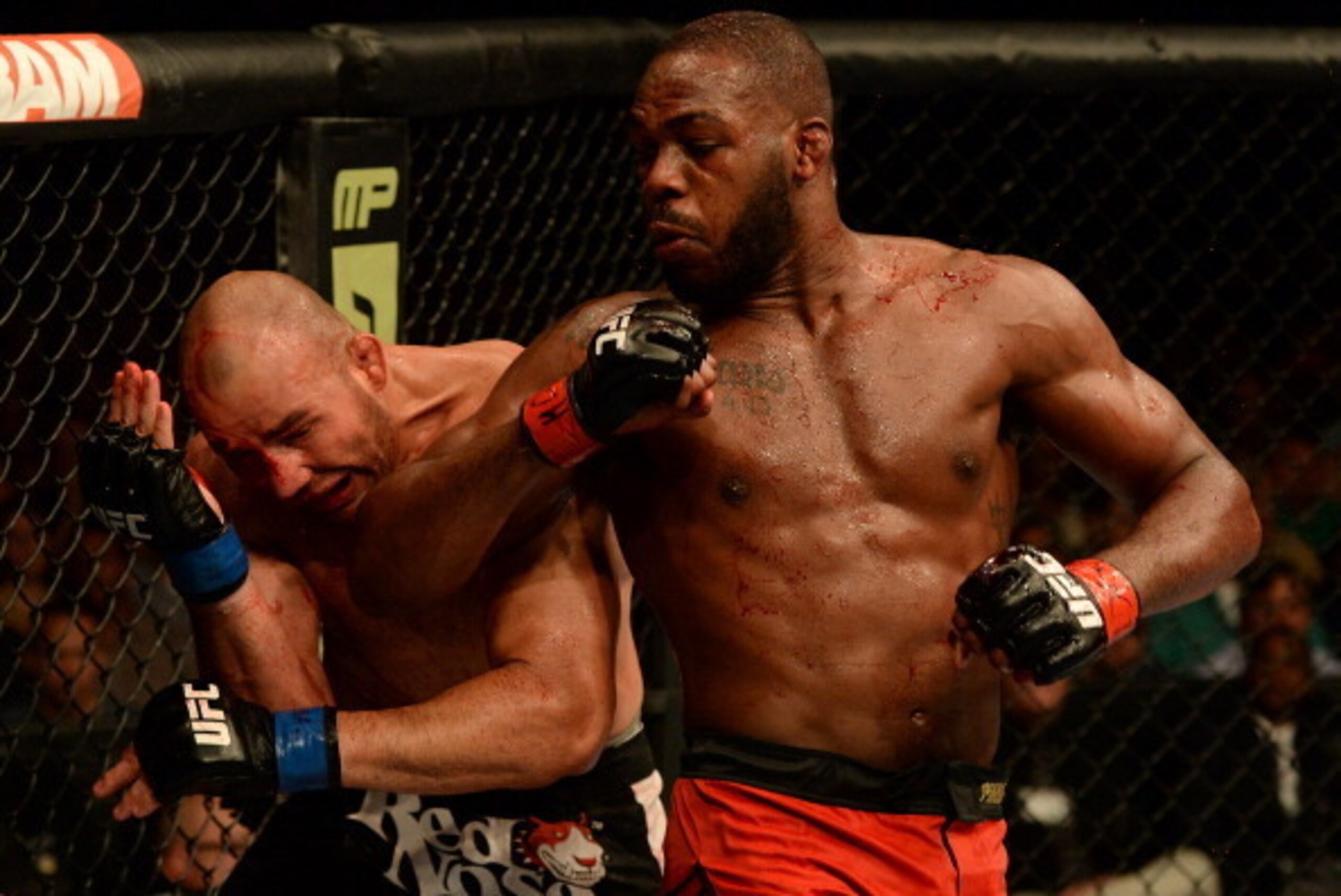 BALTIMORE, MD - APRIL 26:  (R-L) Jon 'Bones' Jones elbows Glover Teixeira in their light heavyweight championship bout during the UFC 172 event at the Baltimore Arena on April 26, 2014 in Baltimore, Maryland. (Photo by Patrick Smith/Zuffa LLC/Zuffa LLC vi
