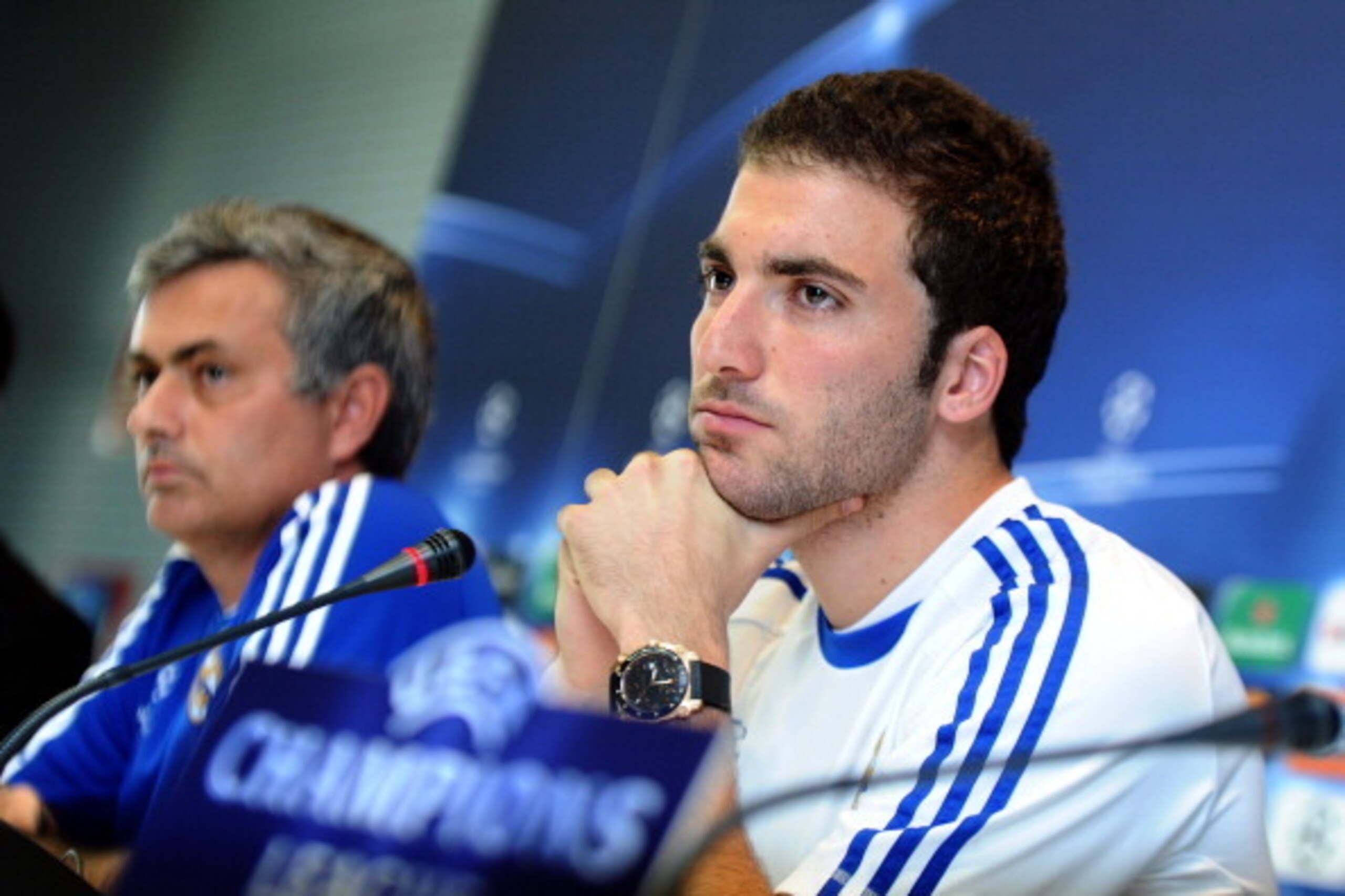 Real Madrid's Argentinian forward Gonzalo Higuain (R) gives a press conference with Real Madrid's Portuguese coach Jose Mourinho (L) in Madrid on April 4, 2011, on the eve of their Champions League quarter-final first leg match against Tottenham Hotspur. 