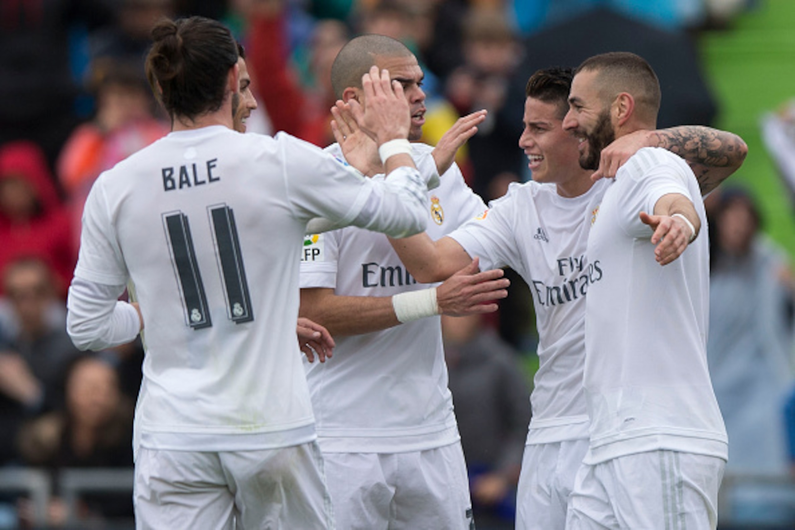 GETAFE, SPAIN - APRIL 16:  Karim Benzema (R) of Real Madrid CF celebrates scoring their opening goal with teammates James Rodriguez (2ndR), Gareth Bale (L), Cristiano Ronaldo (2ndL) and Pepe (3dL) during the La Liga match between Getafe CF and Real Madrid