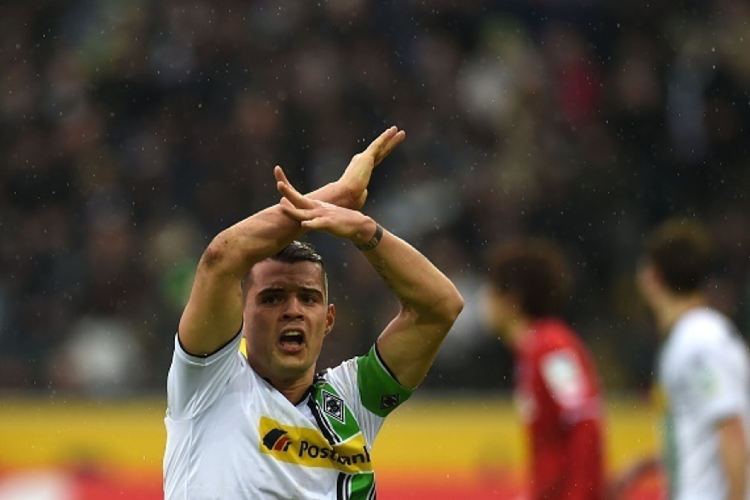 Moenchengladbach's Swiss midfielder Granit Xhaka reacts during the German first division Bundesliga football match Borussia Moenchengladbach vs 1. FC Cologne in Moenchengladbach , western Germany, on February  20, 2016. / AFP / PATRIK STOLLARZ / RESTRICTI