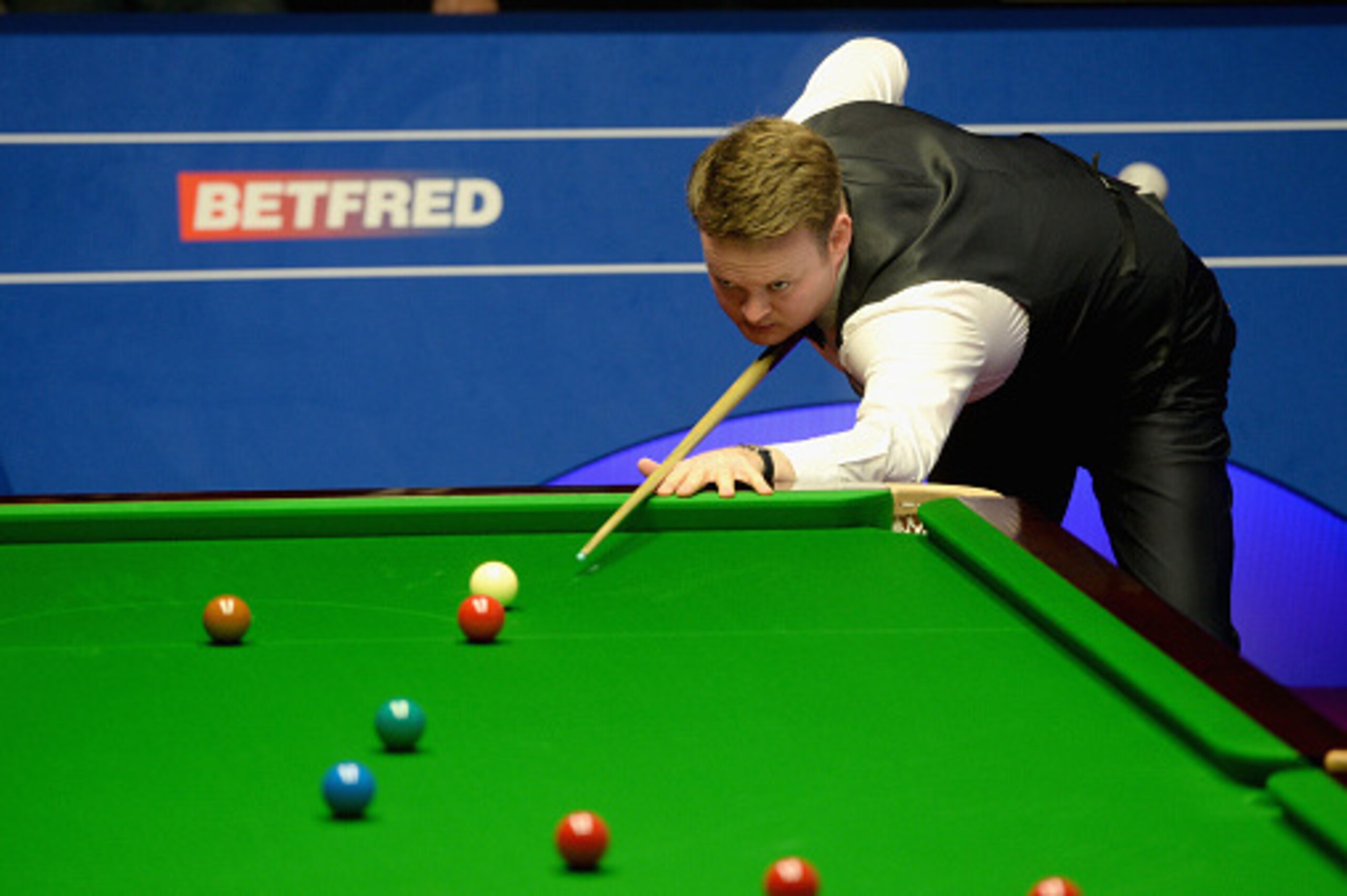 SHEFFIELD, ENGLAND - APRIL 17:  Shaun Murphy plays a shot against Anthony McGill during their first round match of the 2016 Betfred World Snooker Championship at Crucible Theatre on April 17, 2016 in Sheffield, England.  (Photo by Gareth Copley/Getty Imag