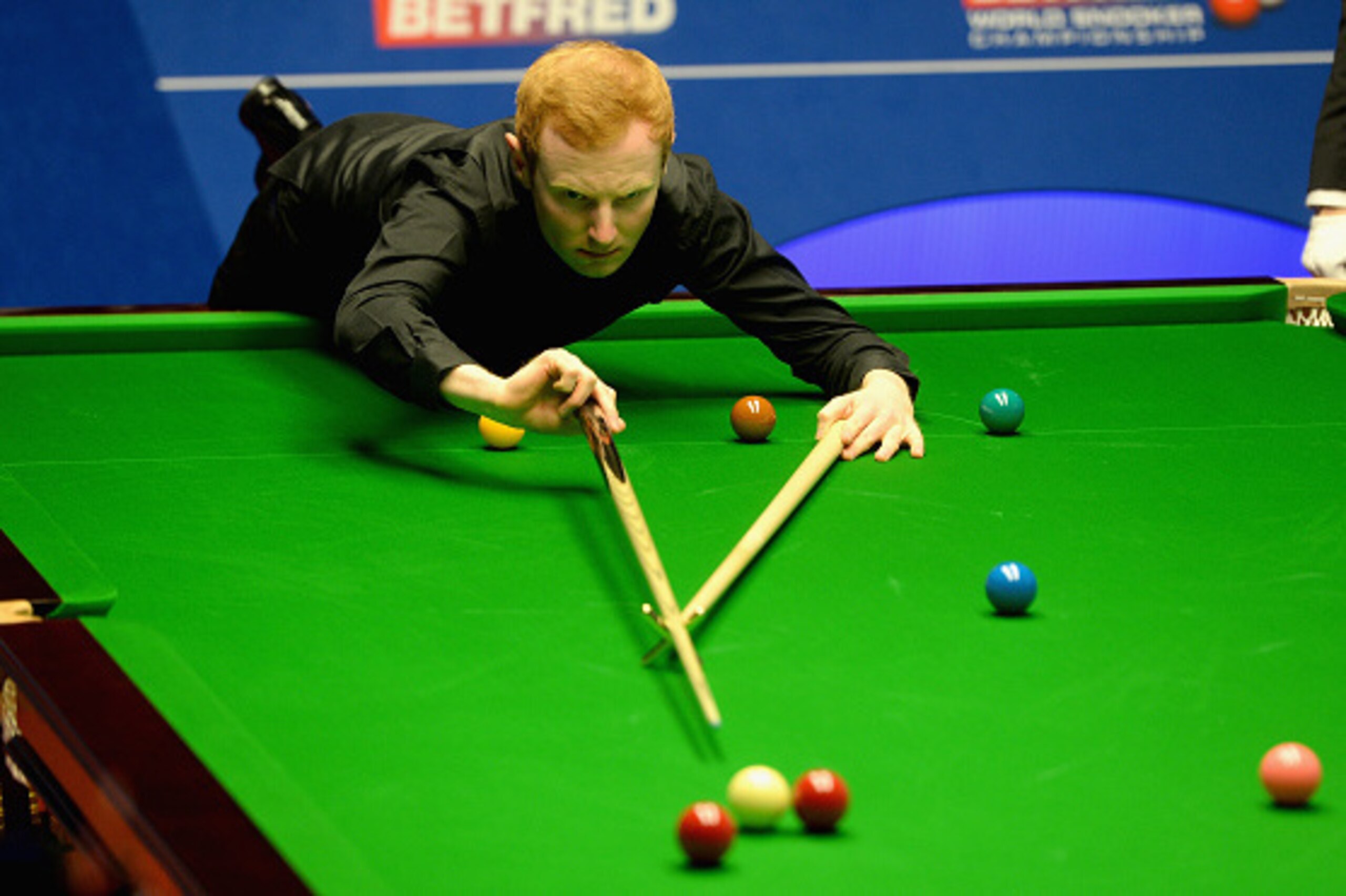 SHEFFIELD, ENGLAND - APRIL 17:  Anthony McGill plays a shot against Shaun Murphy during their first round match of the 2016 Betfred World Snooker Championship at Crucible Theatre on April 17, 2016 in Sheffield, England.  (Photo by Gareth Copley/Getty Imag
