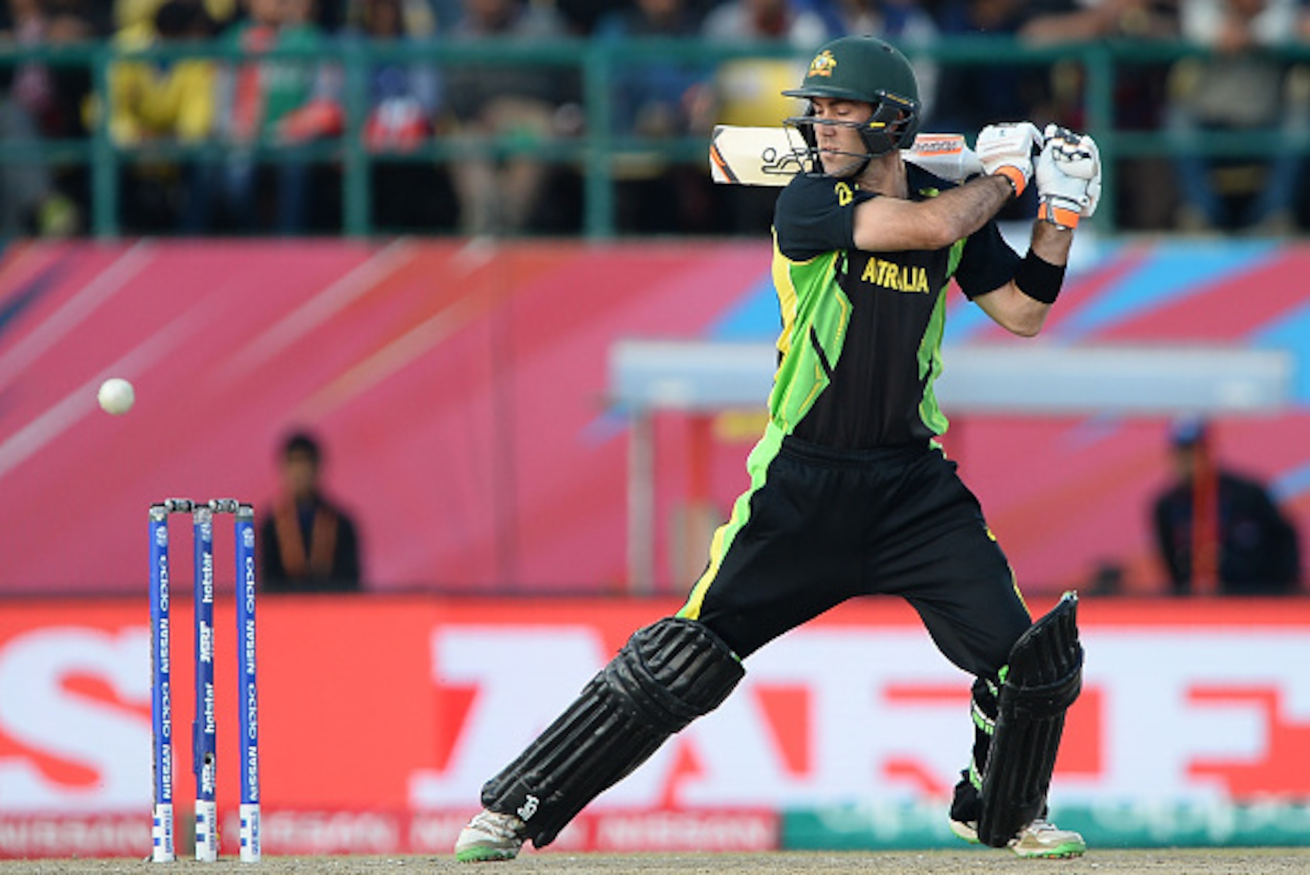 Australia's Glenn Maxwell plays a shot during the World T20 cricket tournament match between Australia and New Zealand at The Himachal Pradesh Cricket Association Stadium (HPCA) in Dharamsala on March 18, 2016.
 / AFP / SAJJAD HUSSAIN        (Photo credit