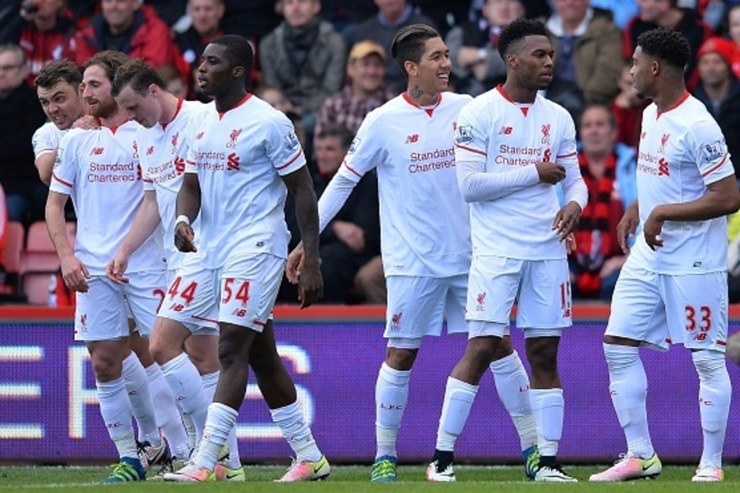 Liverpool's English striker Daniel Sturridge (2L) celebrates scoring his team's second goal with Liverpool's English midfielder Jordon Ibe (R) and Liverpool's Brazilian midfielder Roberto Firmino (C) during the English Premier League football match betwee