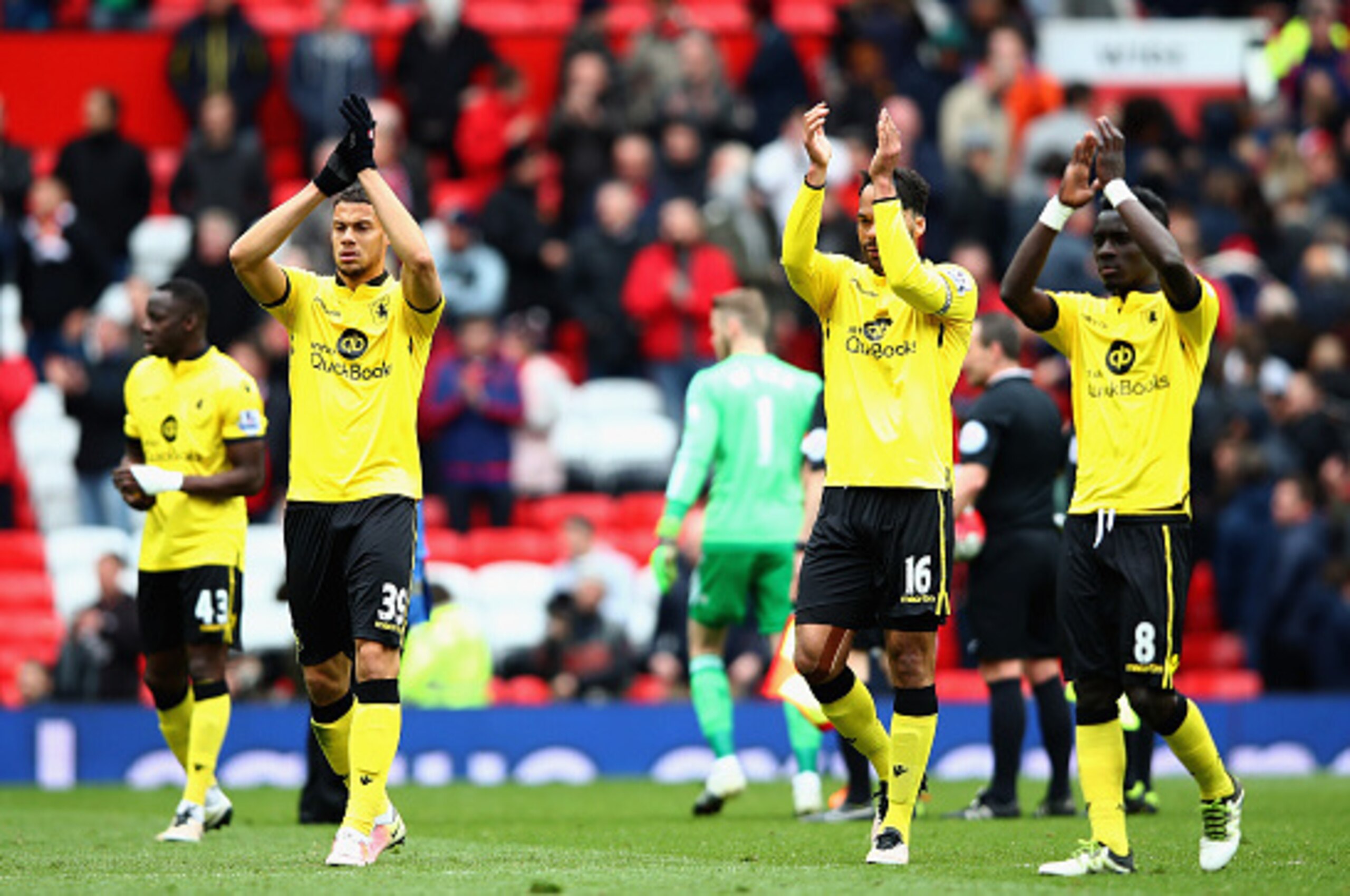 MANCHESTER, ENGLAND - APRIL 16: Aston Villa players applaud the fans after his team were relegated during the Barclays Premier League match between Manchester United and Aston Villa at Old Trafford on April 16, 2016 in Manchester, England.  (Photo by Cliv