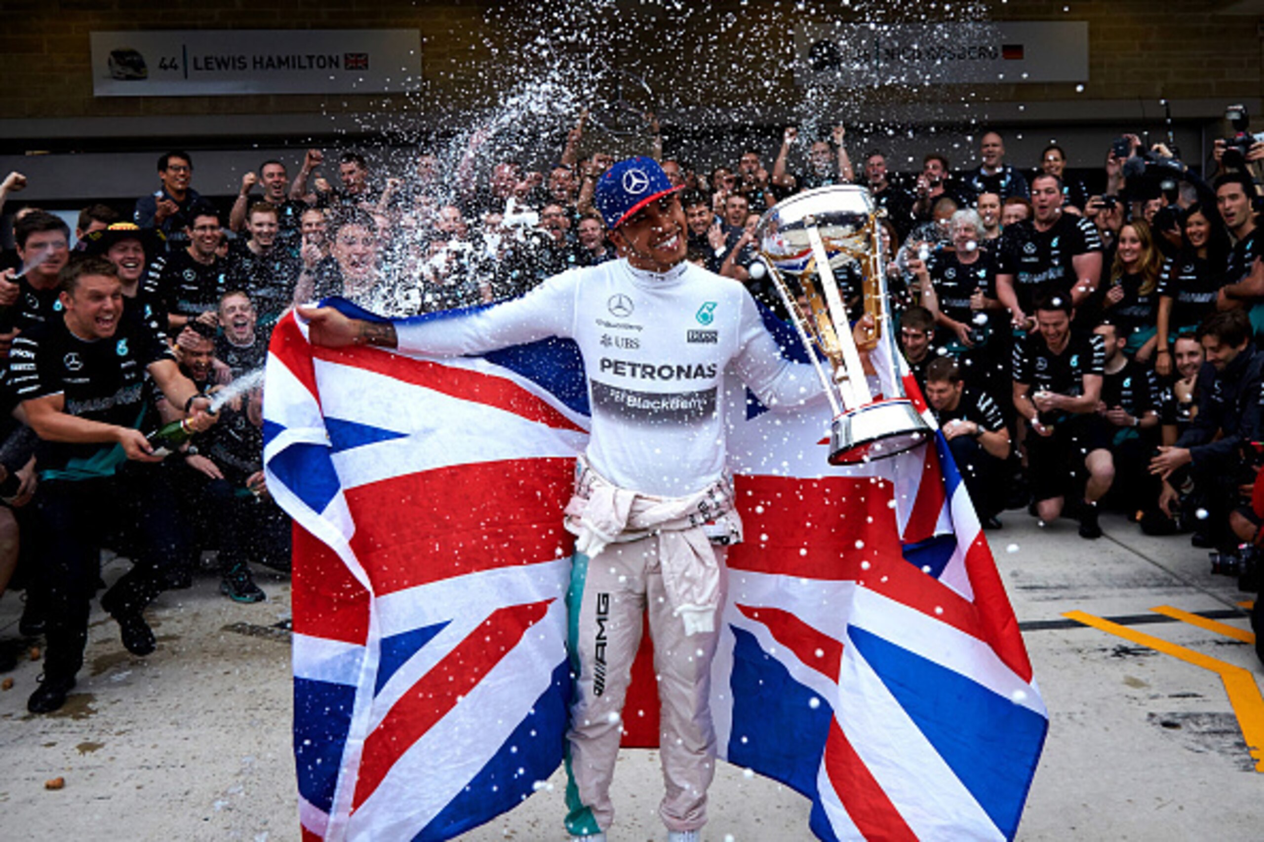 AUSTIN, TX - OCTOBER 25: Lewis Hamilton of Great Britain and Mercedes GP celebrates with the team in the pit lane after winning the United States Formula One Grand Prix and the championship at Circuit of The Americas on October 25, 2015 in Austin, United AUSTIN, TX - OCTOBER 25: Lewis Hamilton of Great Britain and Mercedes GP celebrates with the team in the pit lane after winning the United States Formula One Grand Prix and the championship at Circuit of The Americas on October 25, 2015 in Austin, United