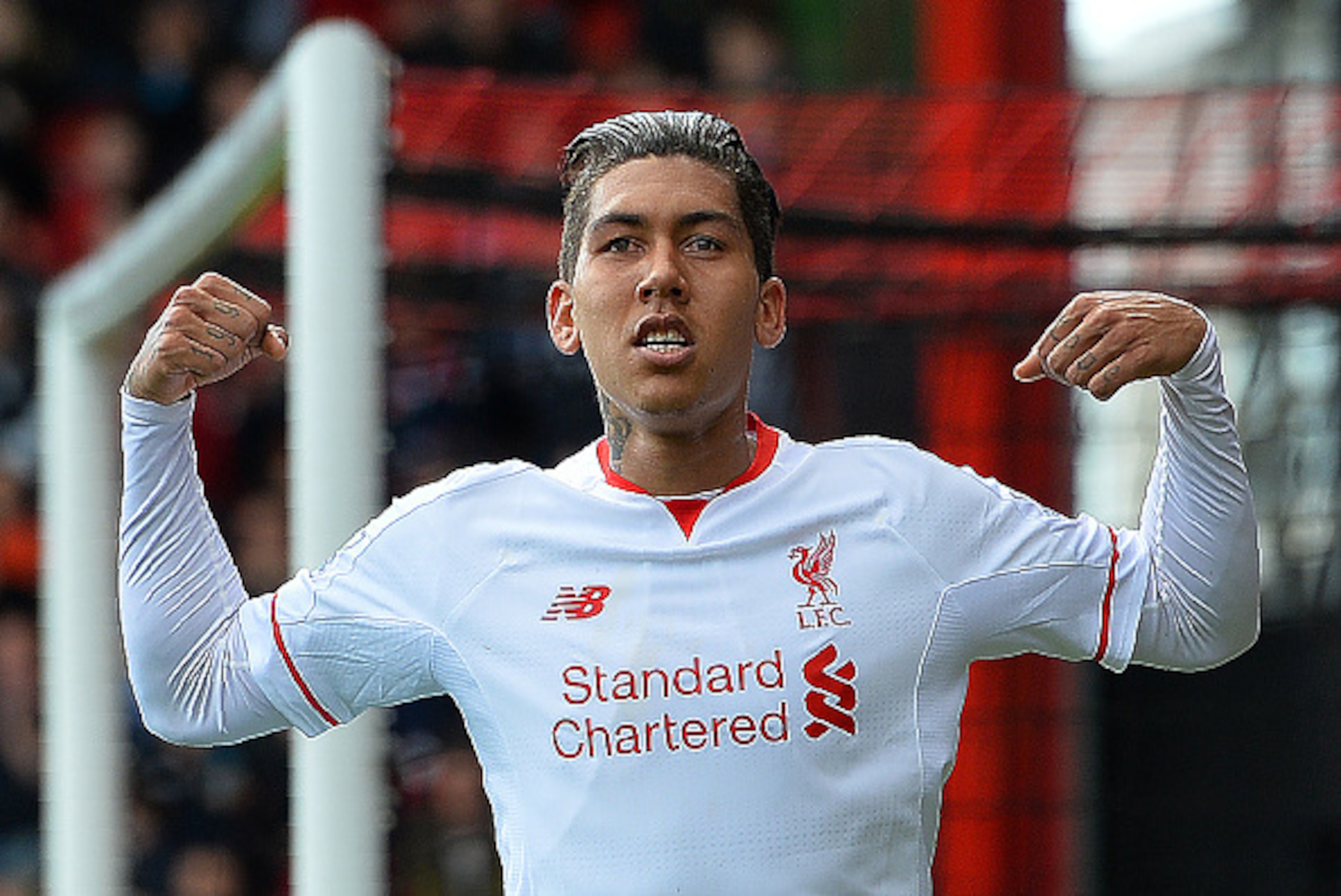Liverpool's Brazilian midfielder Roberto Firmino celebrates scoring his team's first goal during the English Premier League football match between Bournemouth and Liverpool at the Vitality Stadium in Bournemouth, southern England on April 17, 2016. / AFP 