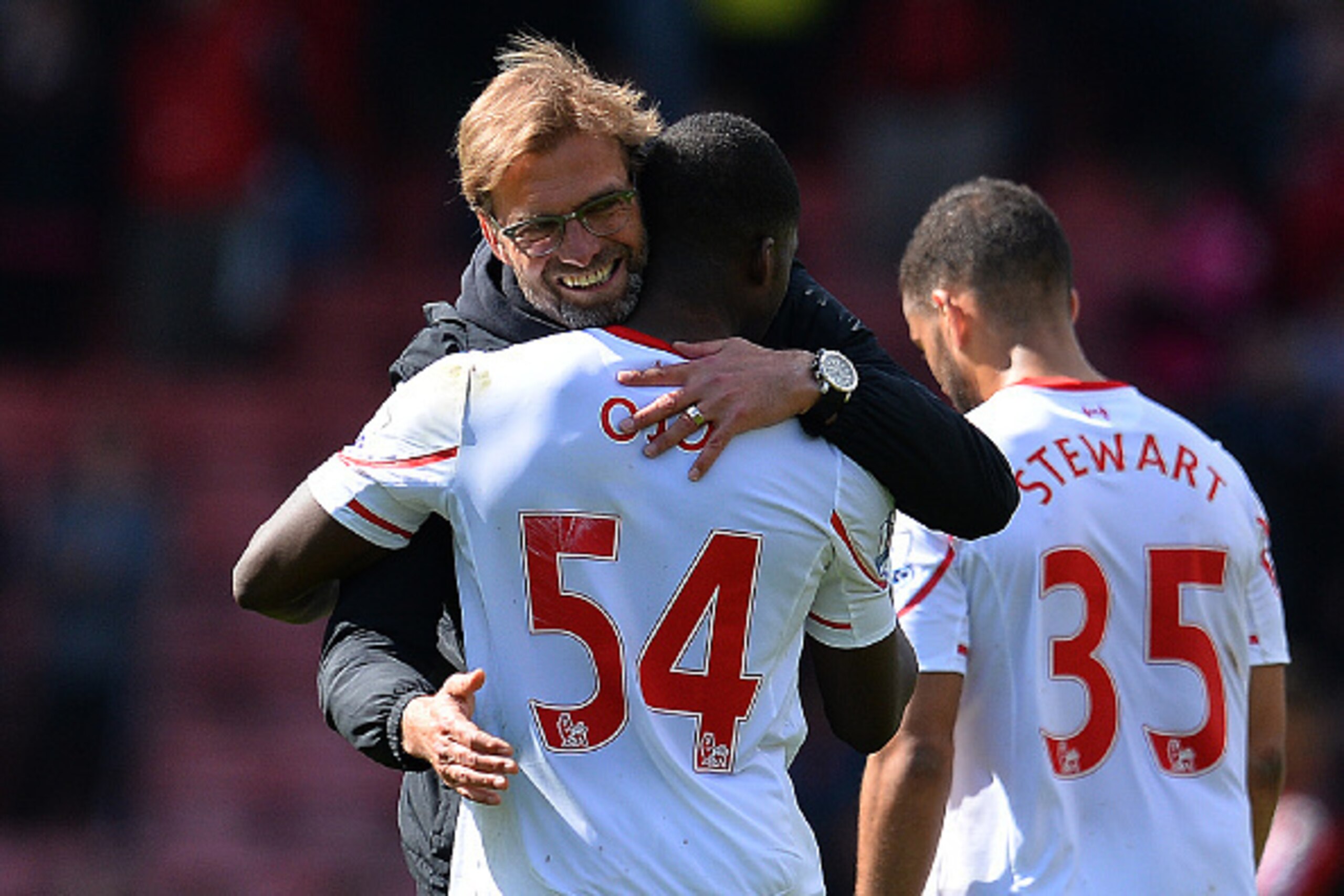 Liverpool's German manager Jurgen Klopp (L) hugs Liverpool's English midfielder Oluwaseyi Ojo following the English Premier League football match between Bournemouth and Liverpool at the Vitality Stadium in Bournemouth, southern England on April 17, 2016.