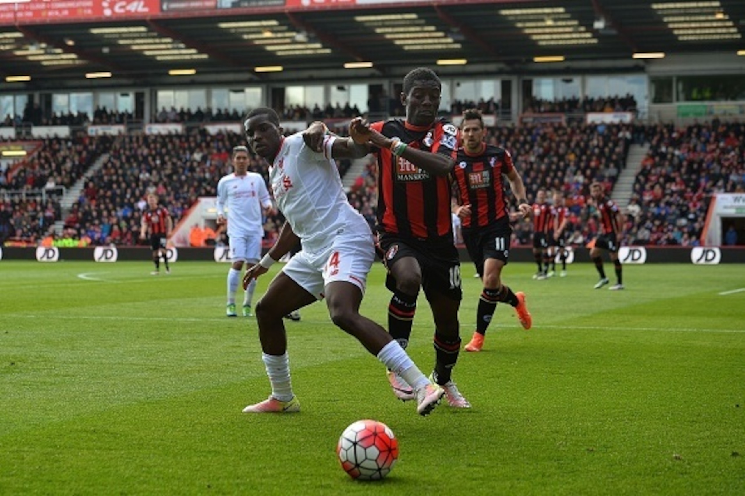 Liverpool's English midfielder Oluwaseyi Ojo (L) vies Bournemouth's Ivorian midfielder Max Gradel with during the English Premier League football match between Bournemouth and Liverpool at the Vitality Stadium in Bournemouth, southern England on April 17,